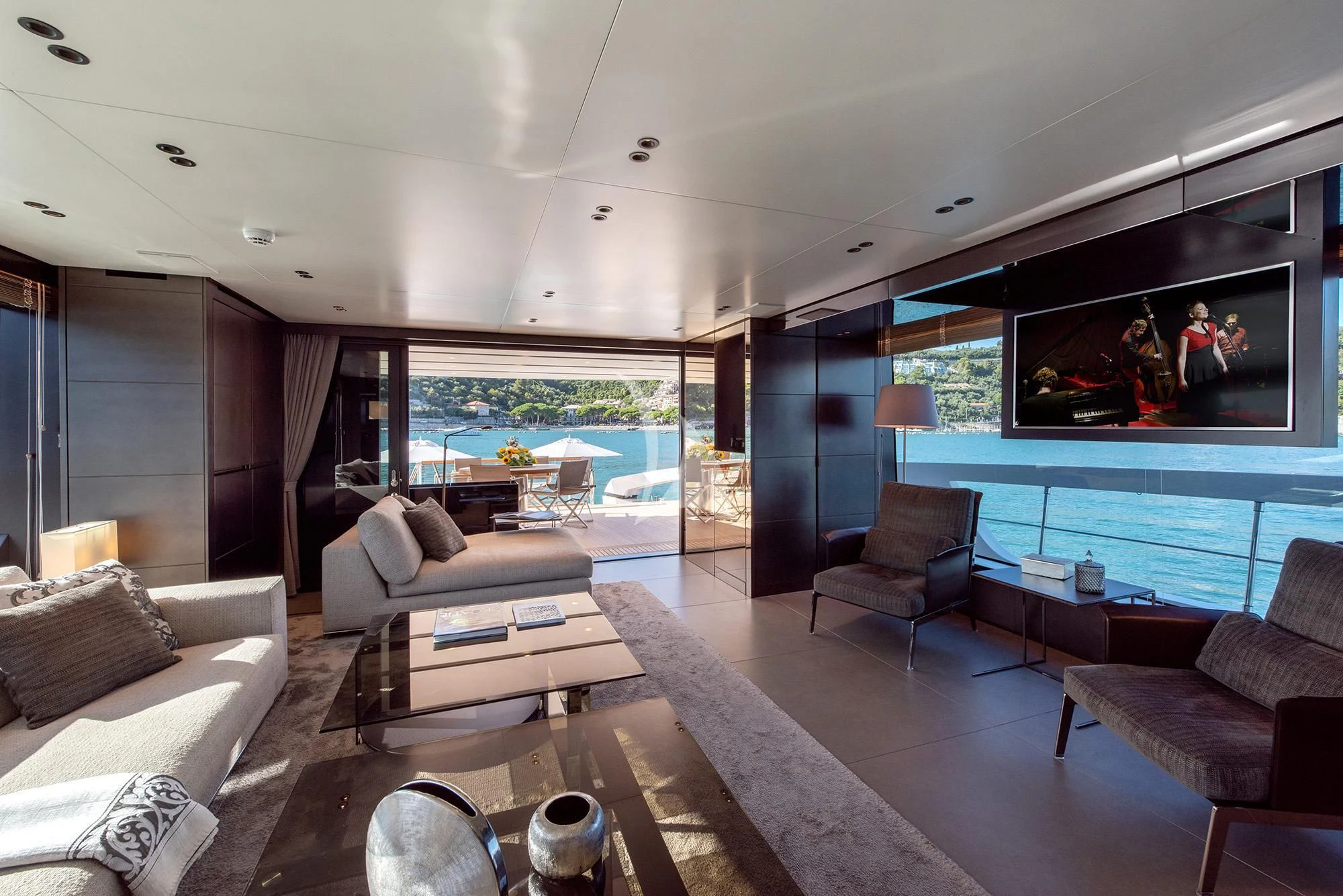 a living room with a large window aboard TIBERIAS Yacht for Sale