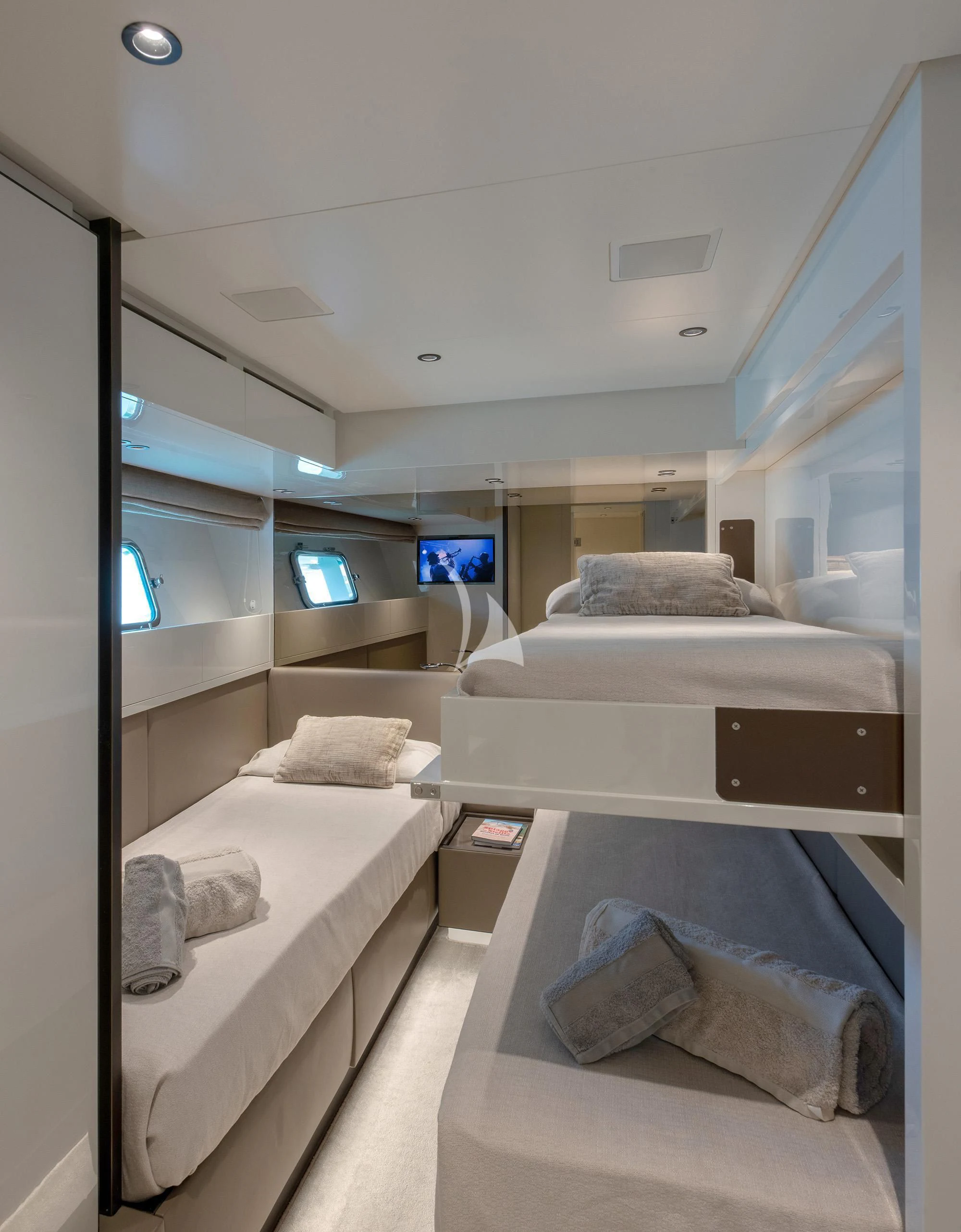 a room with a bed and a television aboard TIBERIAS Yacht for Sale