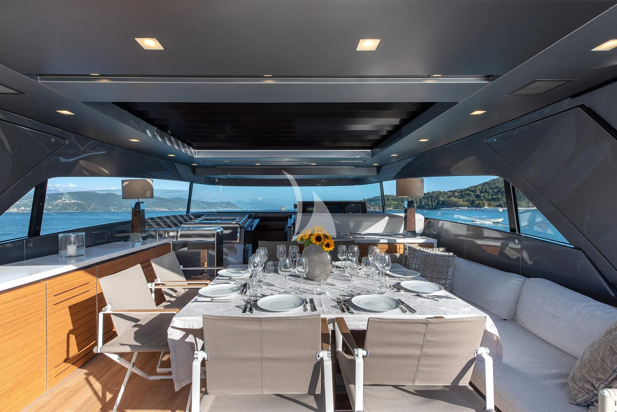 a dining room with a large white table and chairs aboard TIBERIAS Yacht for Sale