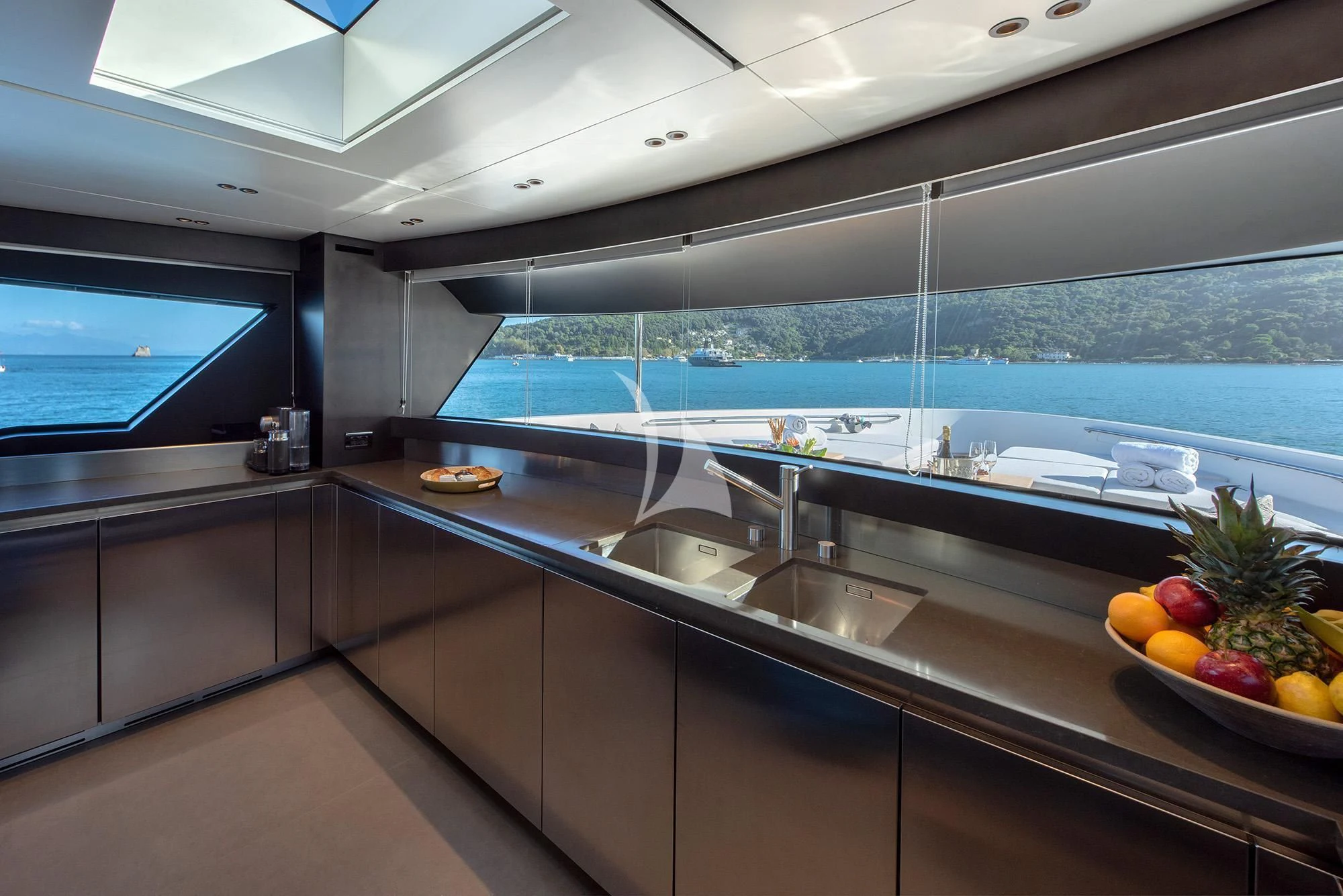 a kitchen with a large island aboard TIBERIAS Yacht for Sale
