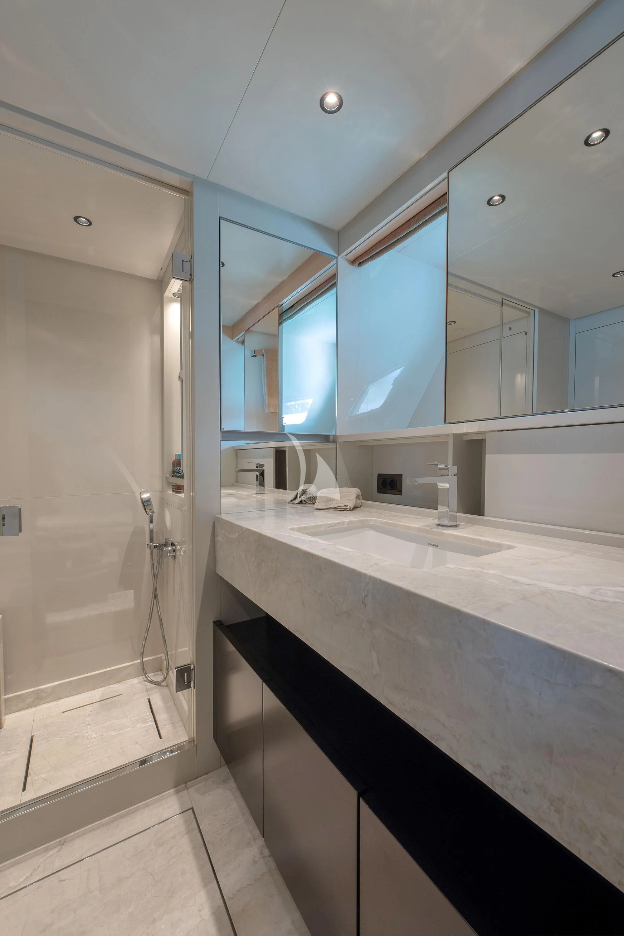a bathroom with a countertop sink and a shower aboard TIBERIAS Yacht for Sale