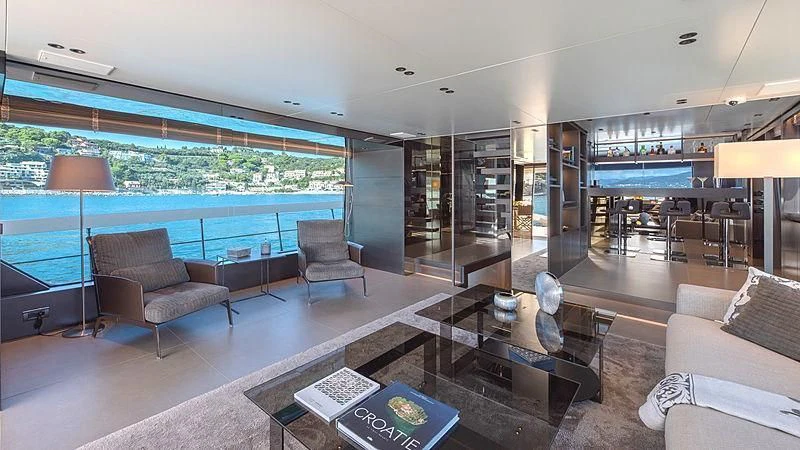 a living room with a large glass wall aboard TIBERIAS Yacht for Sale