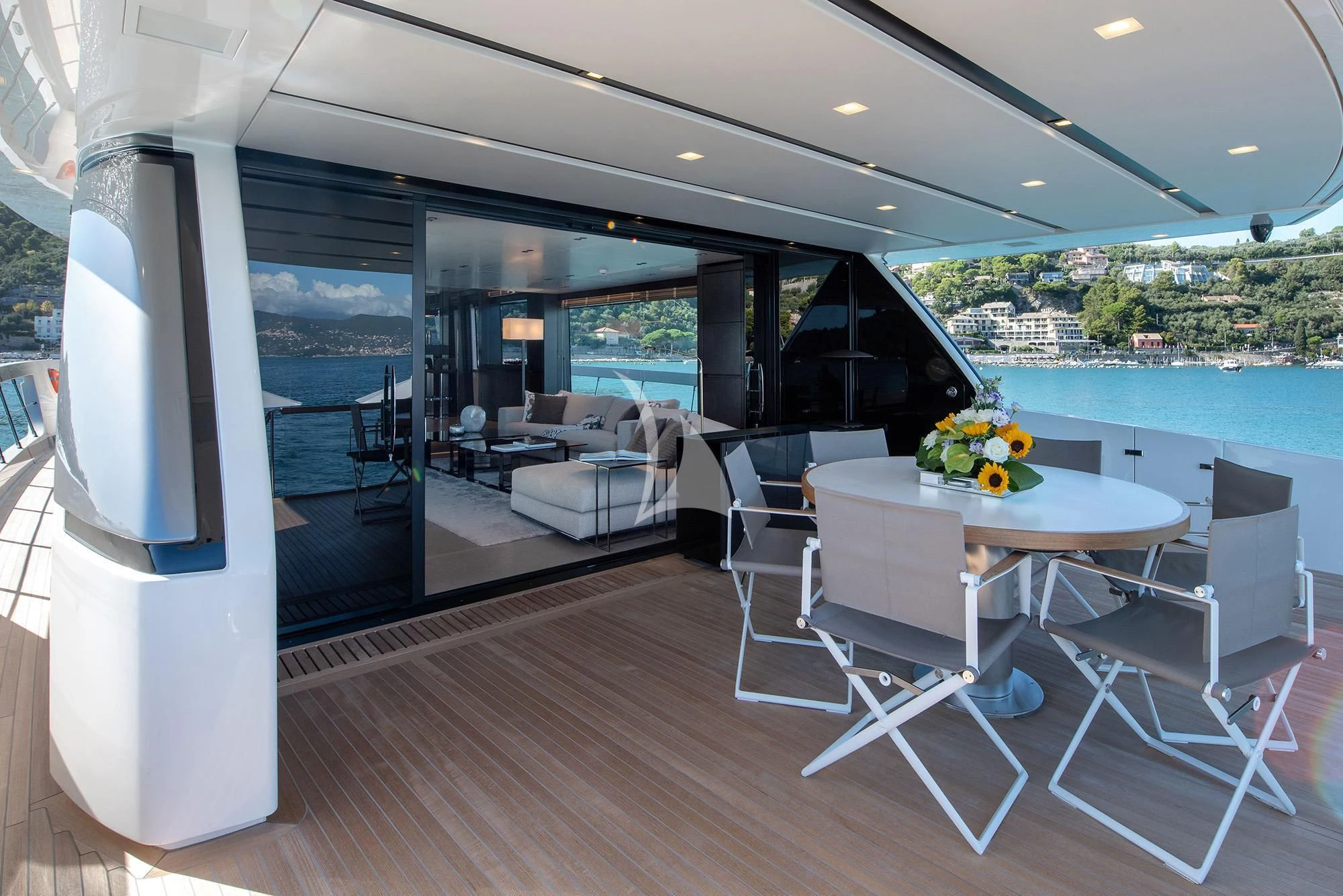 a room with a table and chairs aboard TIBERIAS Yacht for Sale