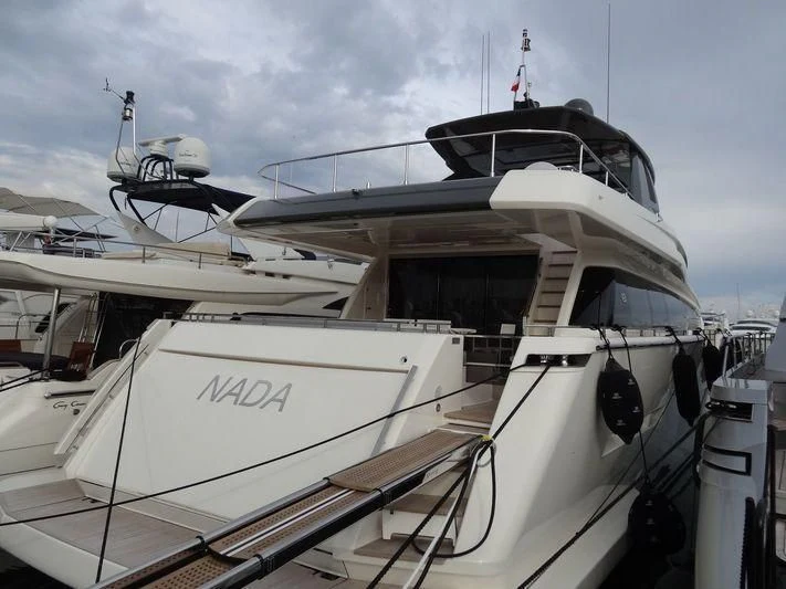 a boat with a white boat aboard DADDY'S DREAM II Yacht for Sale