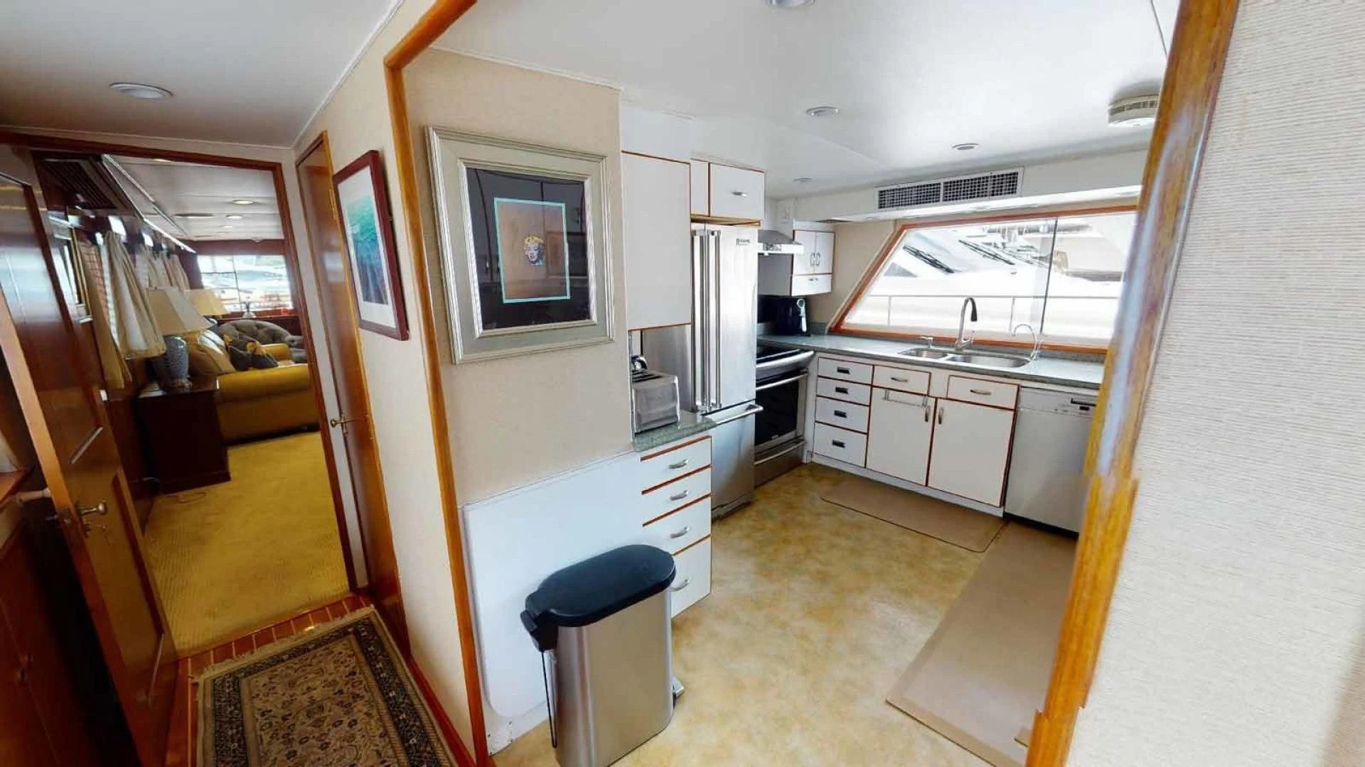 a kitchen with a chair and a stool aboard LORELEI Yacht for Sale