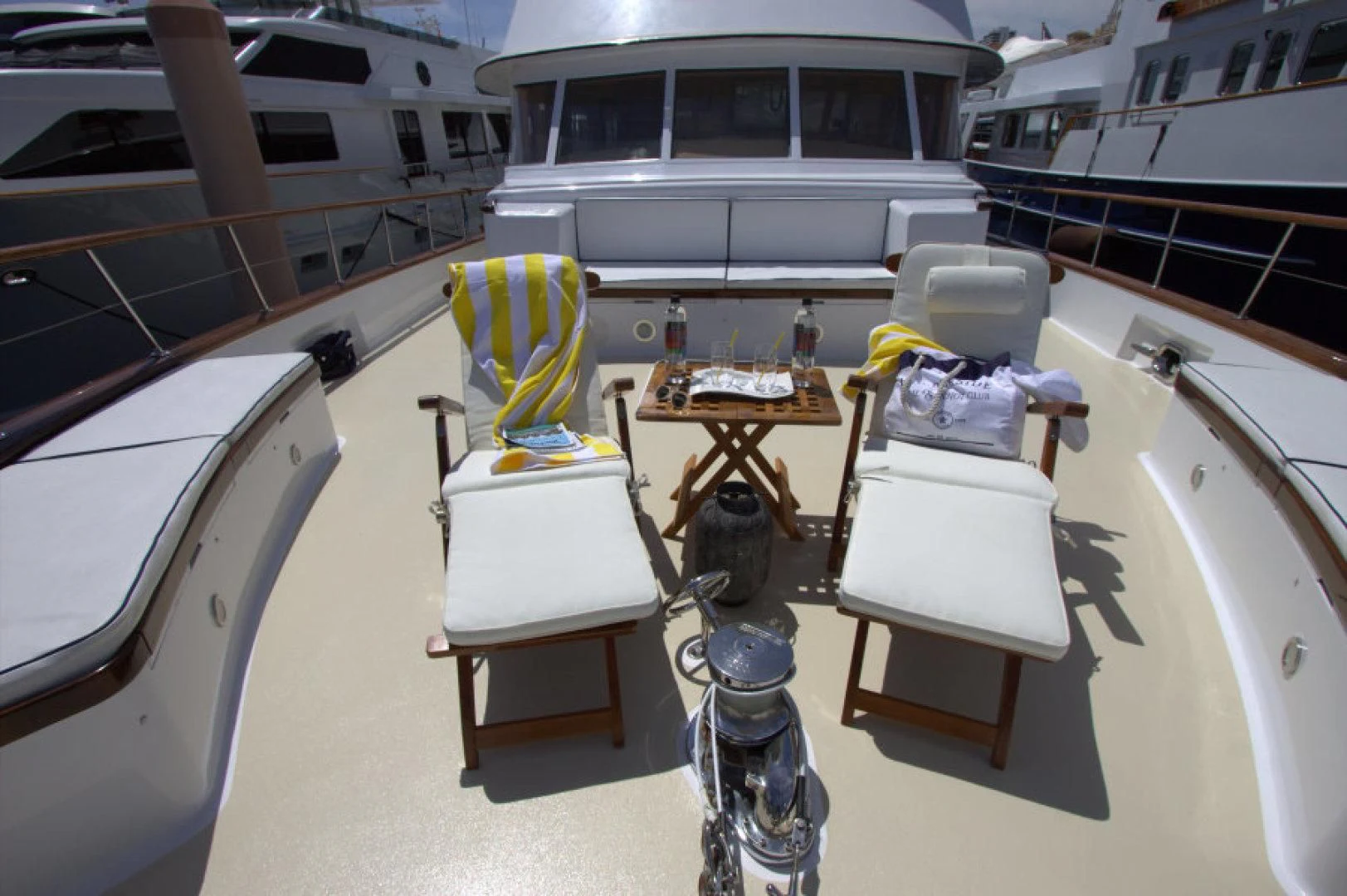 a boat with a table and chairs aboard LORELEI Yacht for Sale