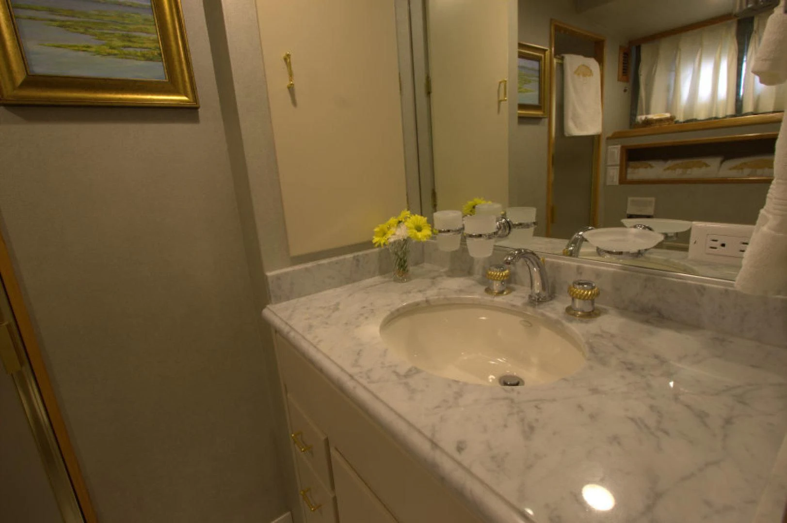 a bathroom with a sink and a mirror aboard LORELEI Yacht for Sale