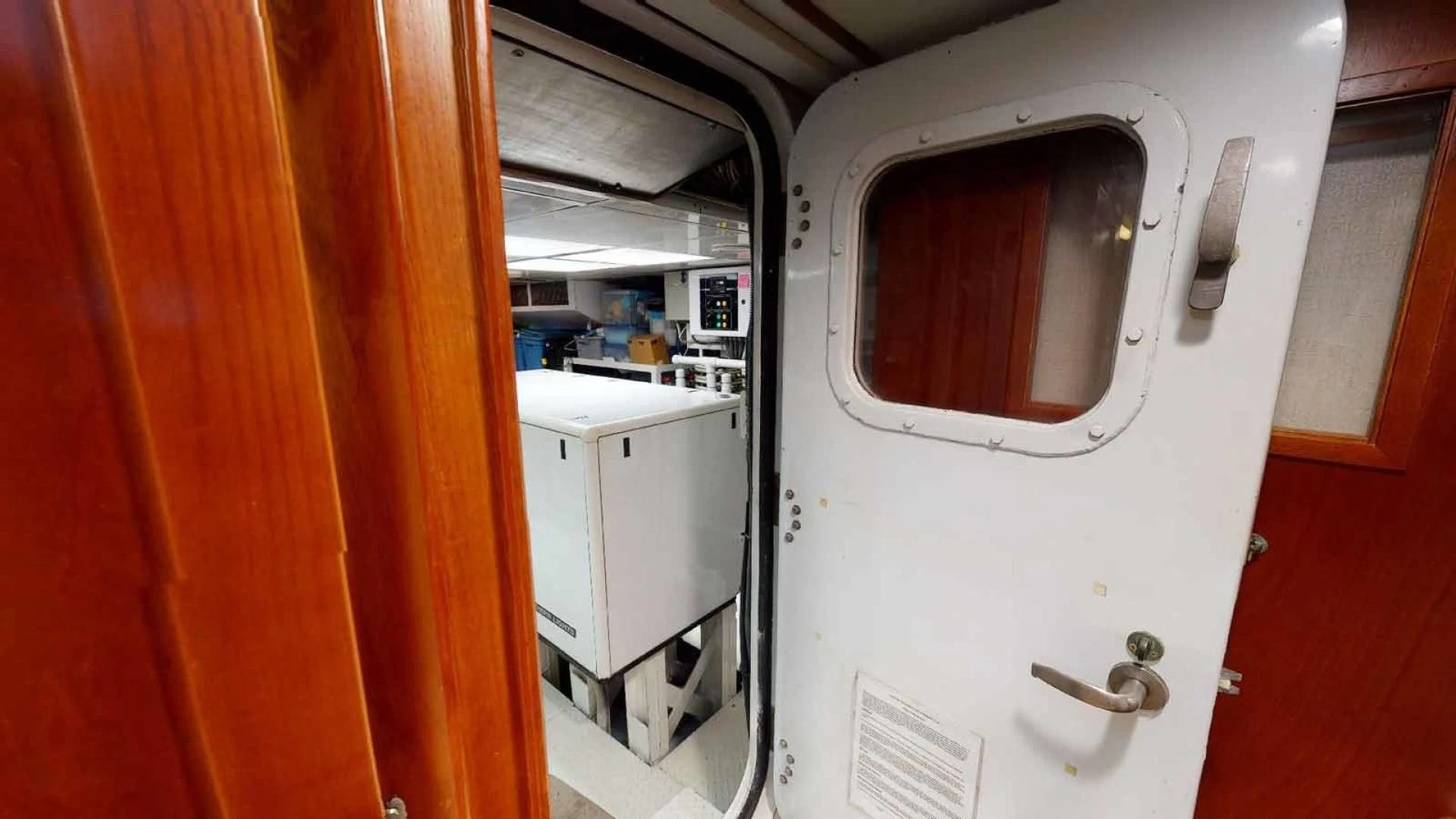 a white machine in a room aboard LORELEI Yacht for Sale