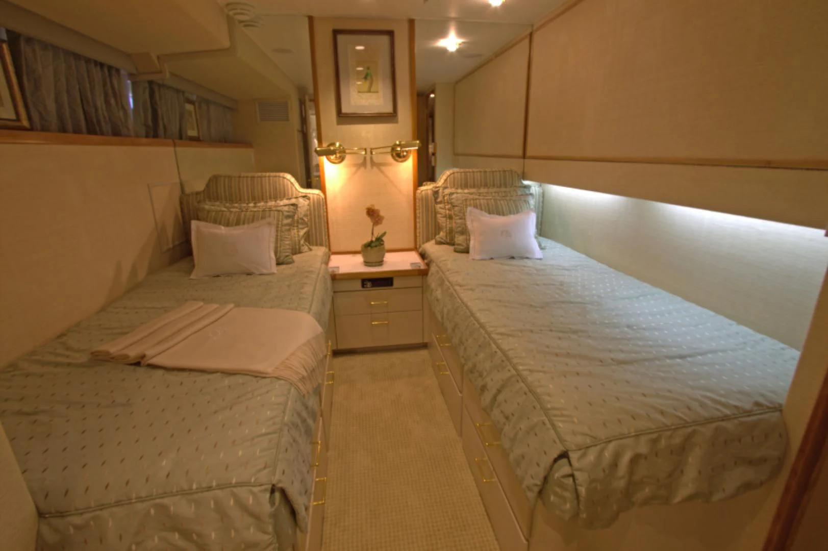 a room with beds and a mirror aboard LORELEI Yacht for Sale