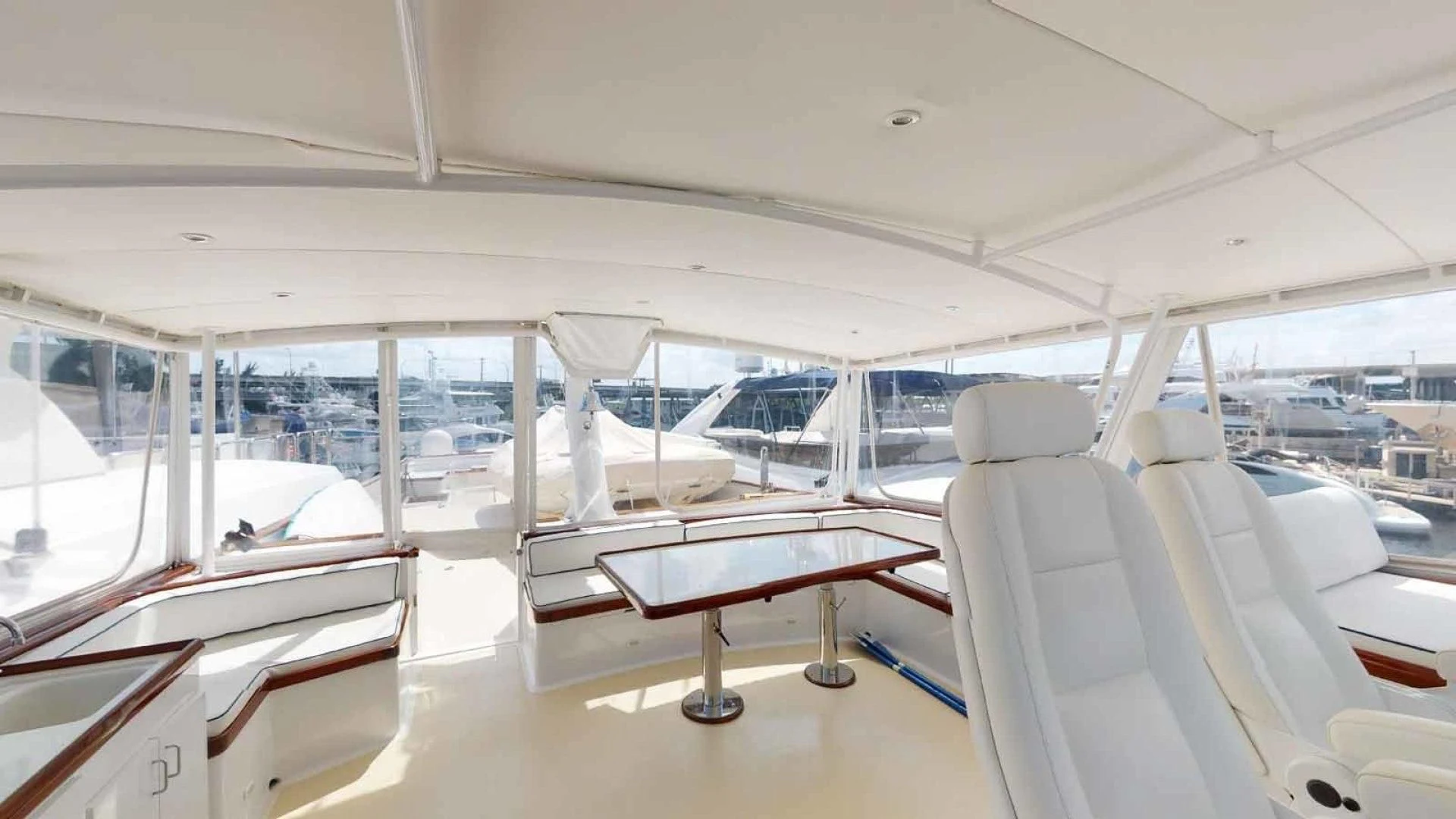 a room with a table and chairs aboard LORELEI Yacht for Sale