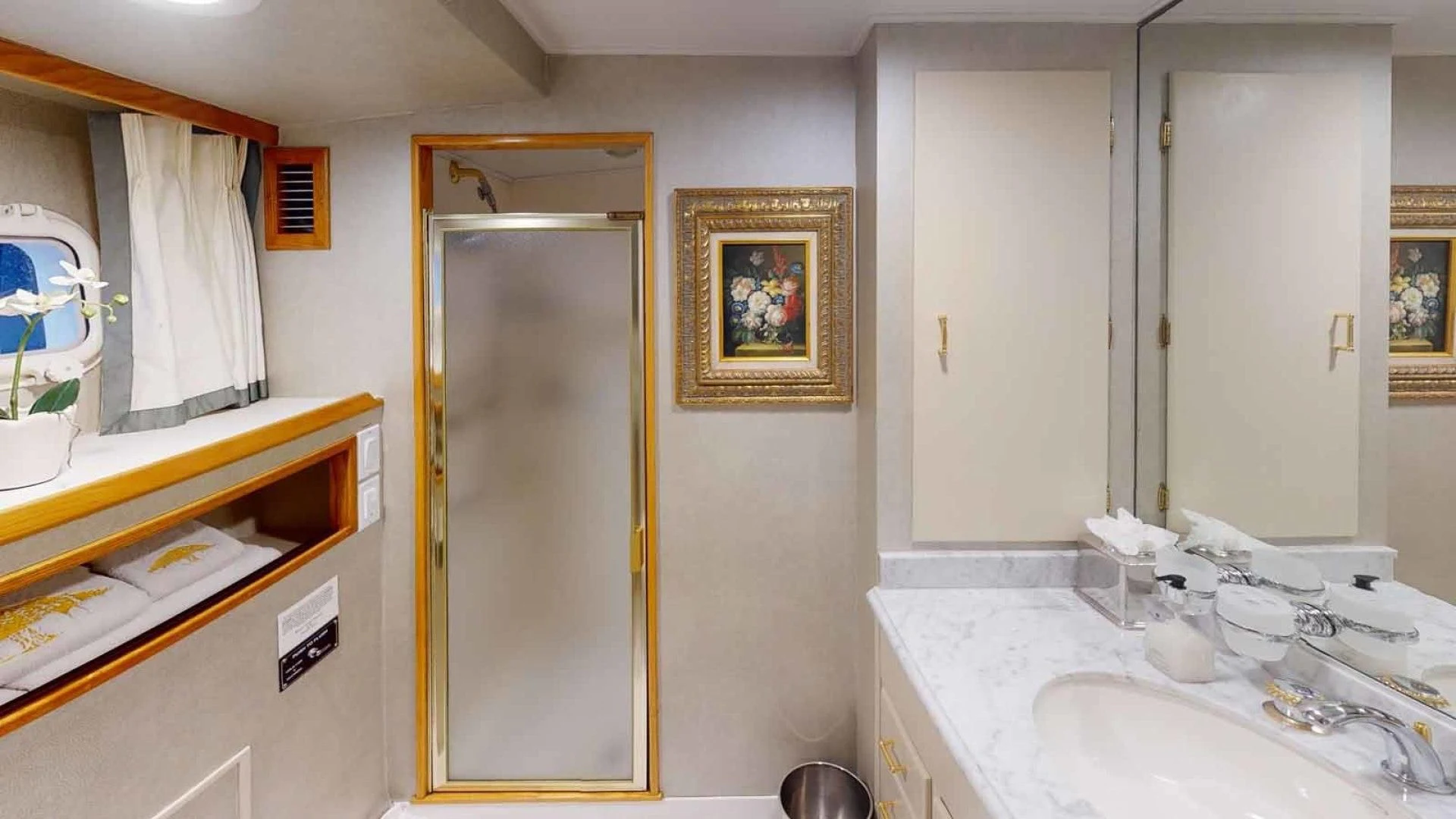 a bathroom with a mirror and a sink aboard LORELEI Yacht for Sale