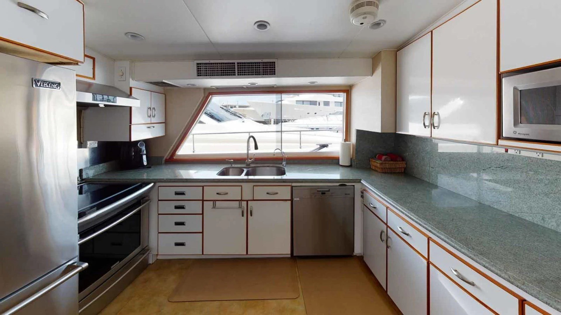 a kitchen with a large island aboard LORELEI Yacht for Sale
