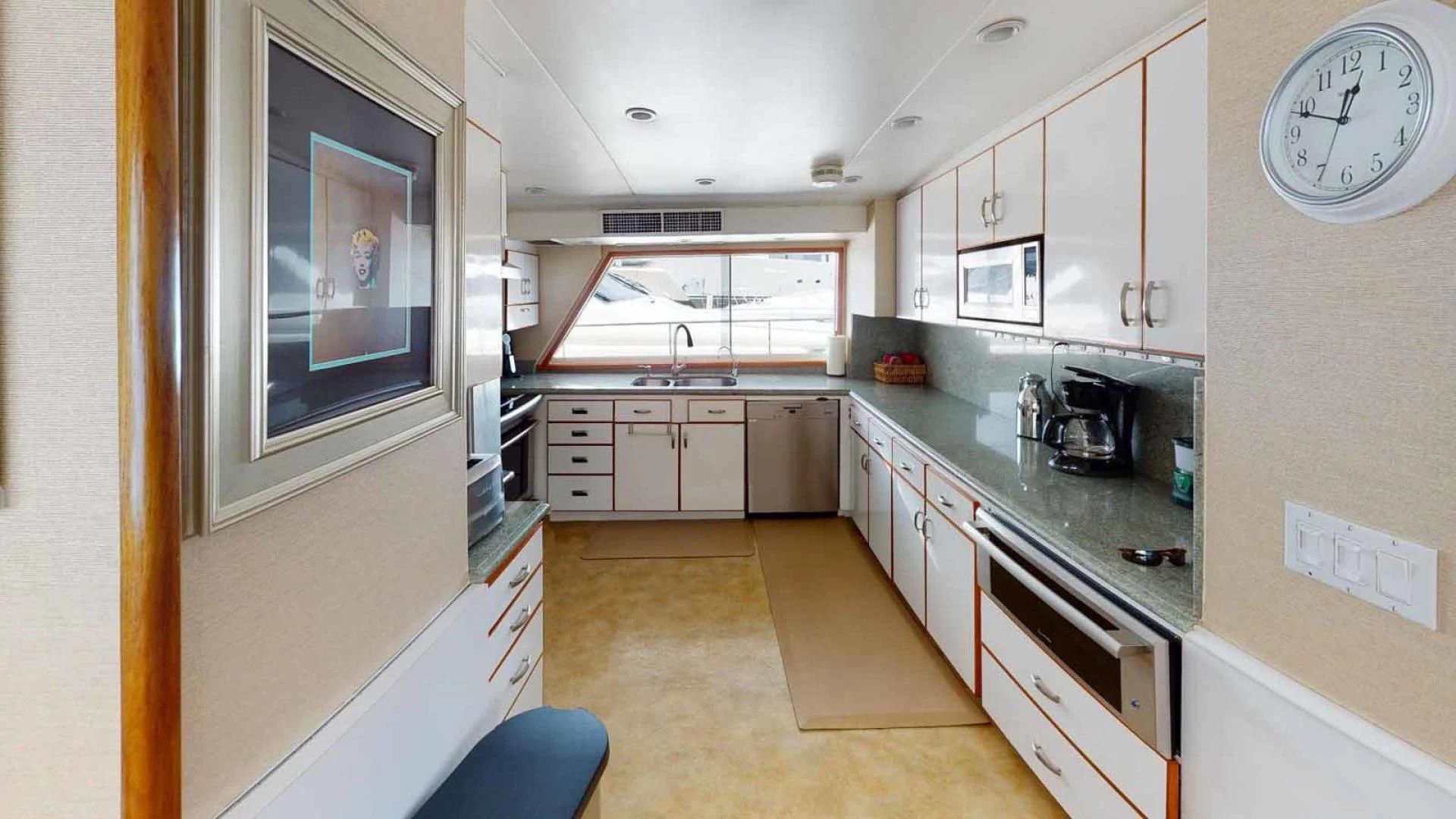 a kitchen with a large window aboard LORELEI Yacht for Sale