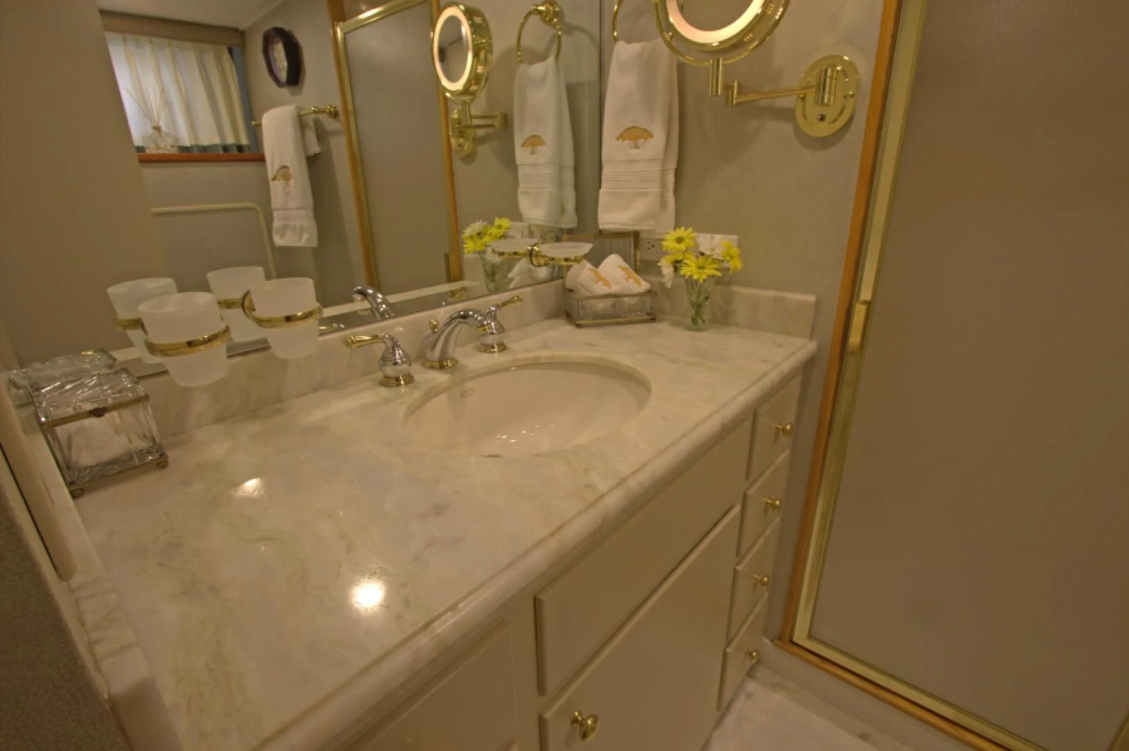 a bathroom with a sink and mirror aboard LORELEI Yacht for Sale