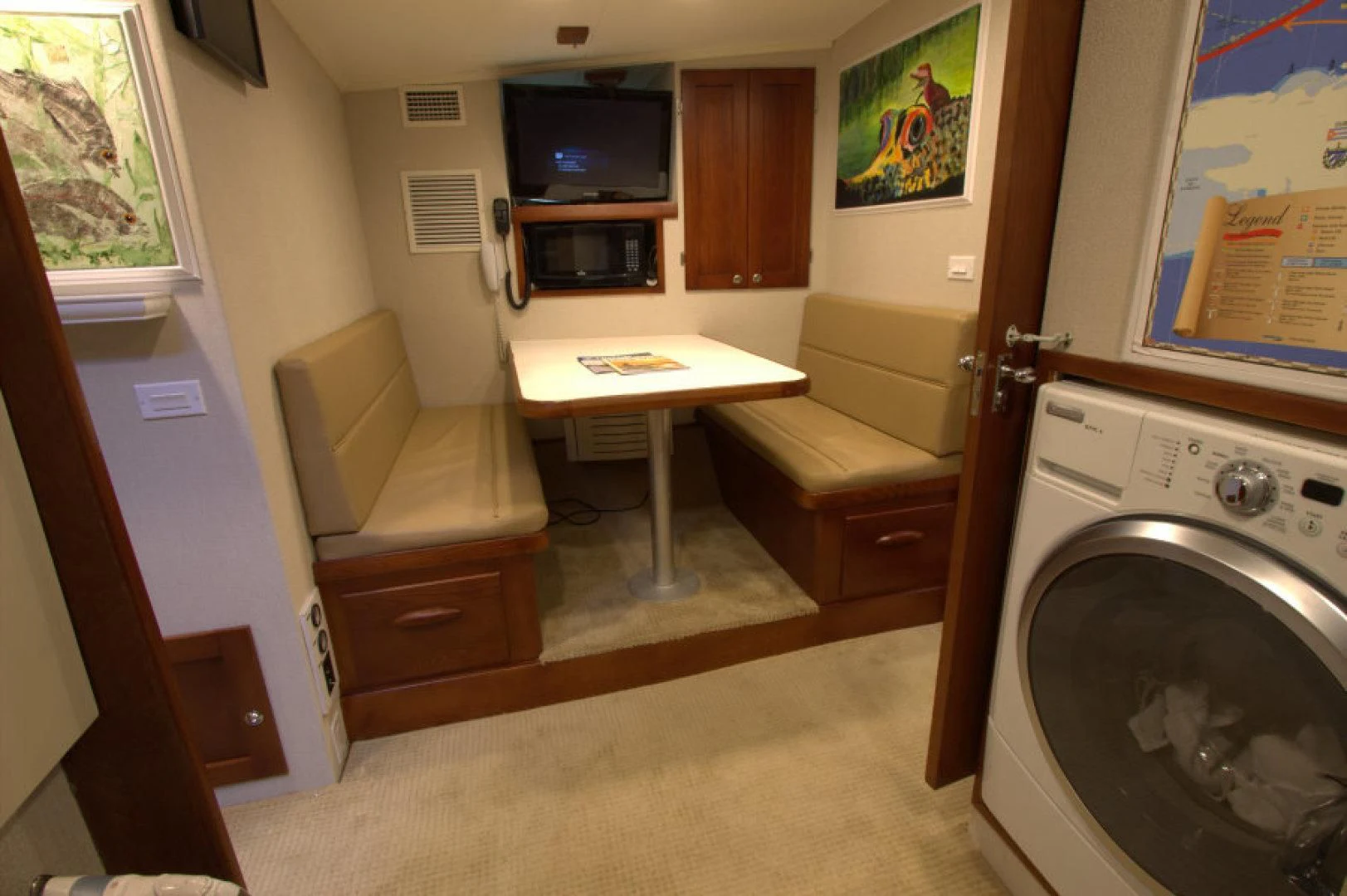 a room with a table and a bed aboard LORELEI Yacht for Sale