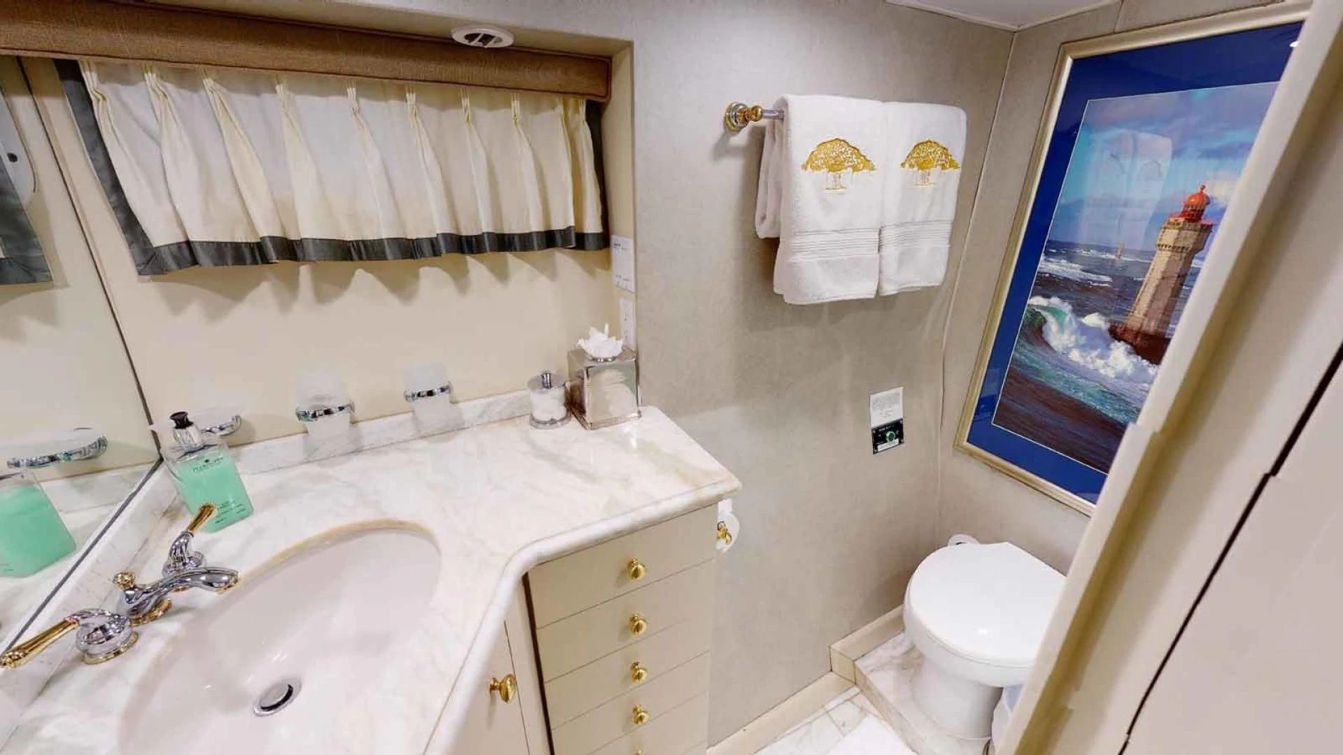 a bathroom with a sink and a toilet aboard LORELEI Yacht for Sale