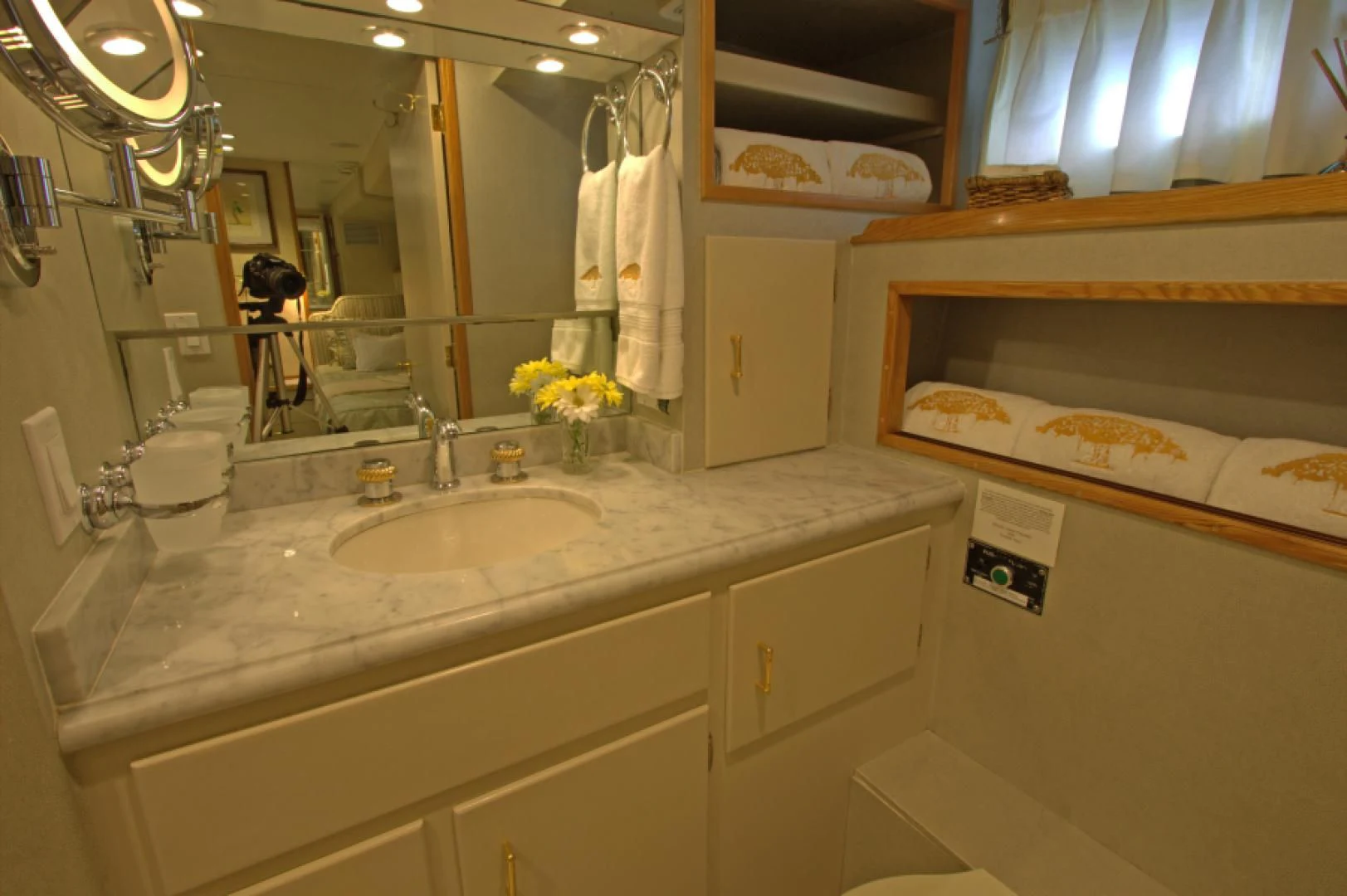 a bathroom with a sink and a mirror aboard LORELEI Yacht for Sale