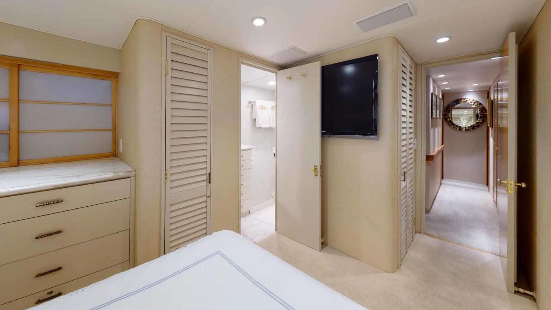 a room with a tv and a bed aboard LORELEI Yacht for Sale
