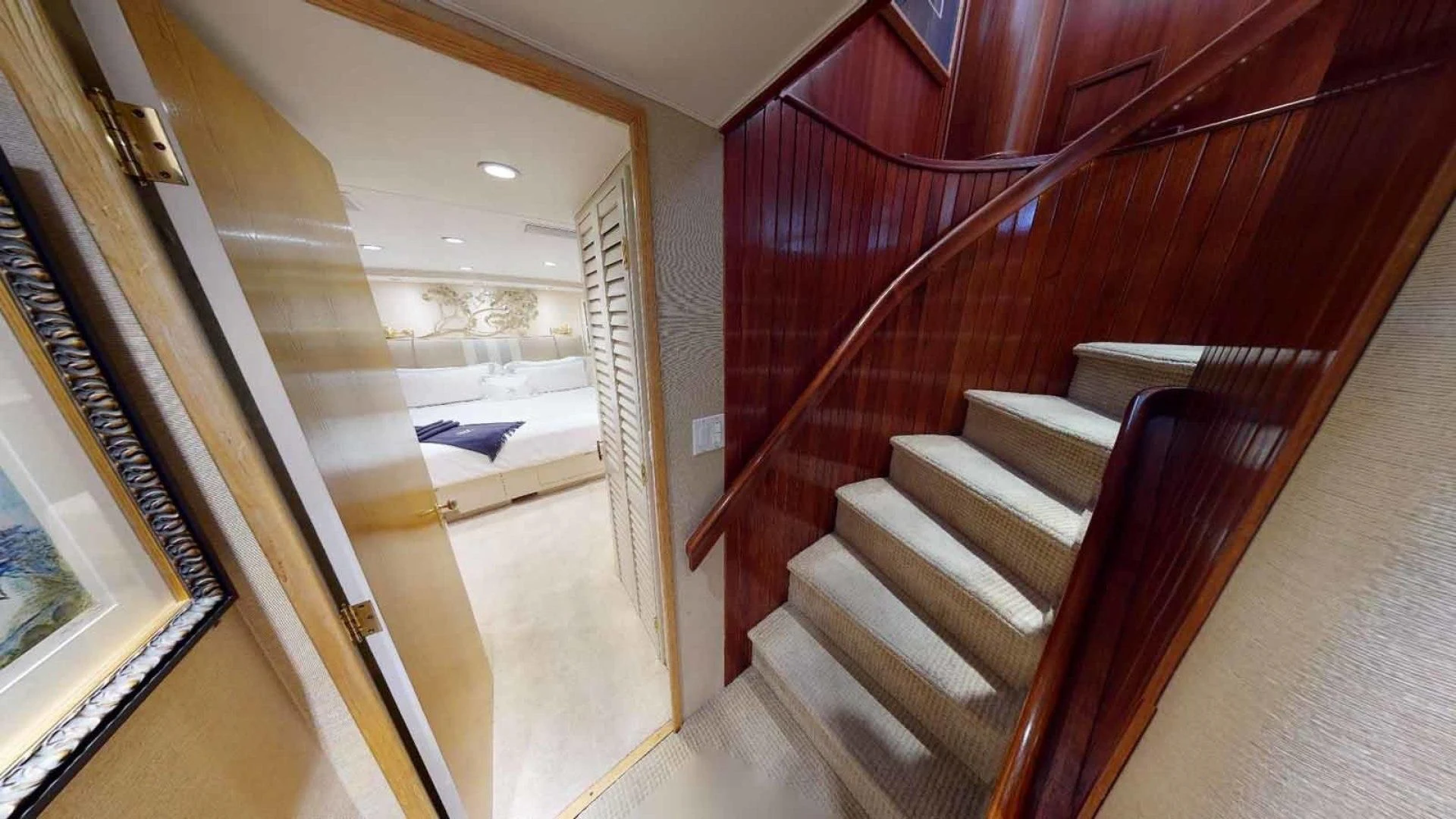 a staircase with red curtains aboard LORELEI Yacht for Sale