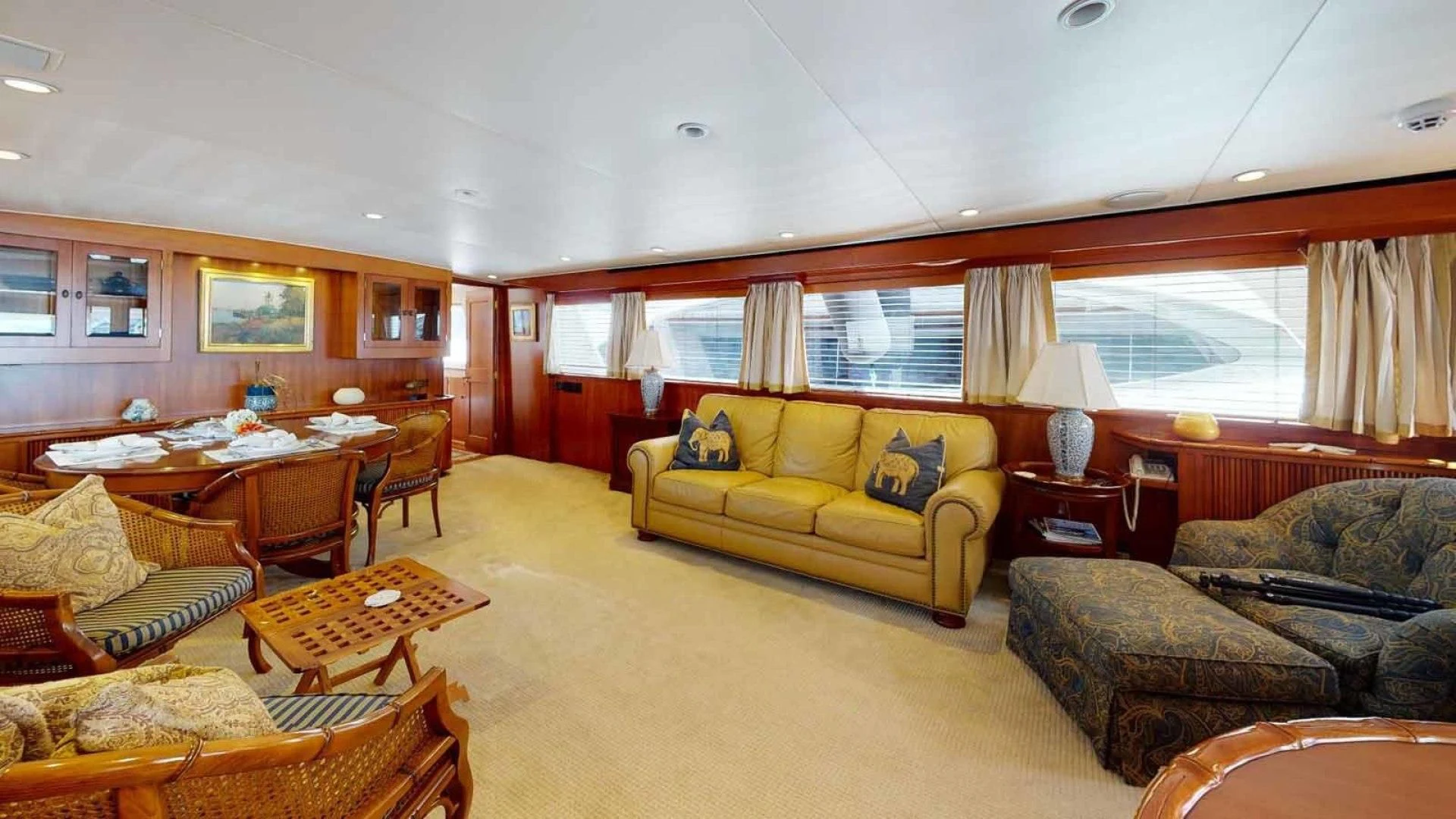 a living room with a couch and a table aboard LORELEI Yacht for Sale