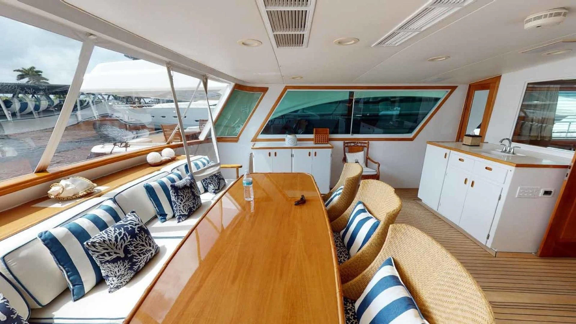 a room with a large bed and a wood floor aboard LORELEI Yacht for Sale