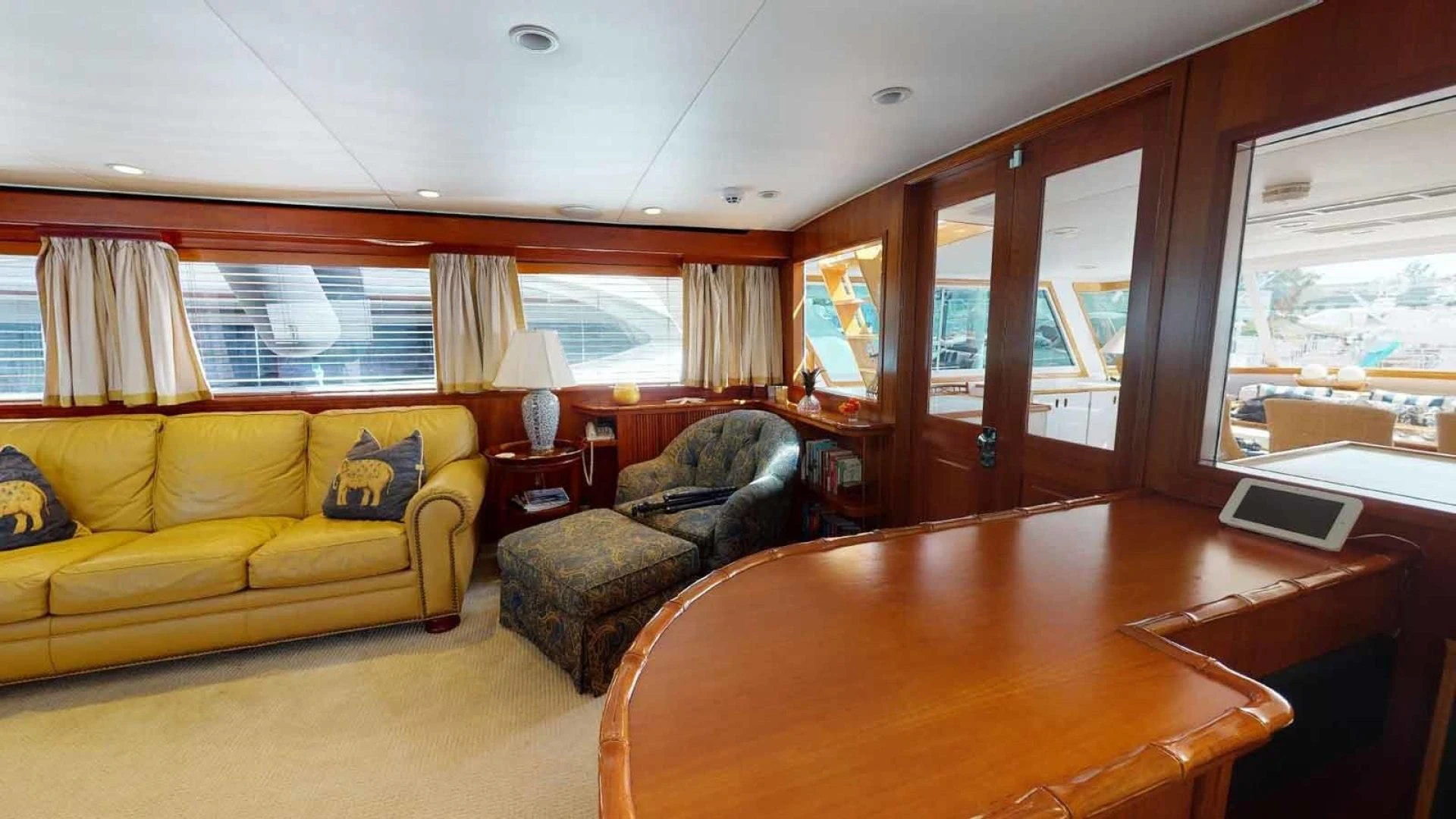 a living room with a couch and a table aboard LORELEI Yacht for Sale