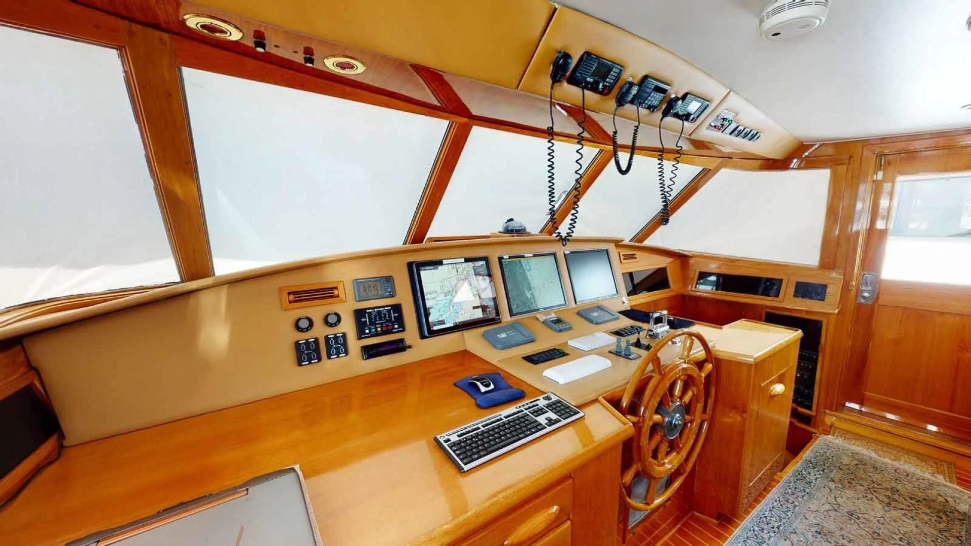 a desk with computers and monitors aboard LORELEI Yacht for Sale