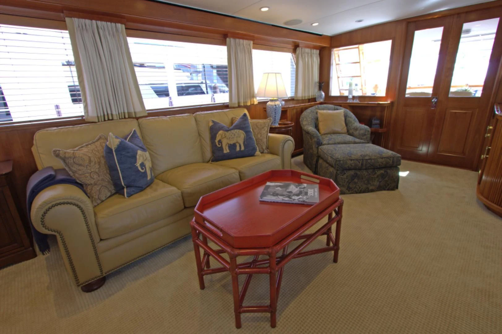 a living room with a couch and a coffee table aboard LORELEI Yacht for Sale