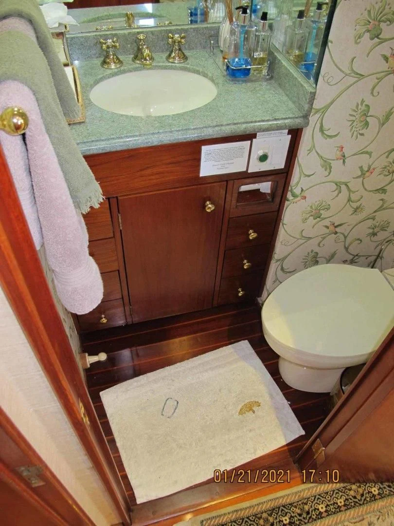 a bathroom with a sink and toilet aboard LORELEI Yacht for Sale
