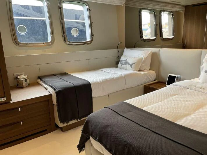 a couple of beds in a room aboard PIACERE III Yacht for Sale
