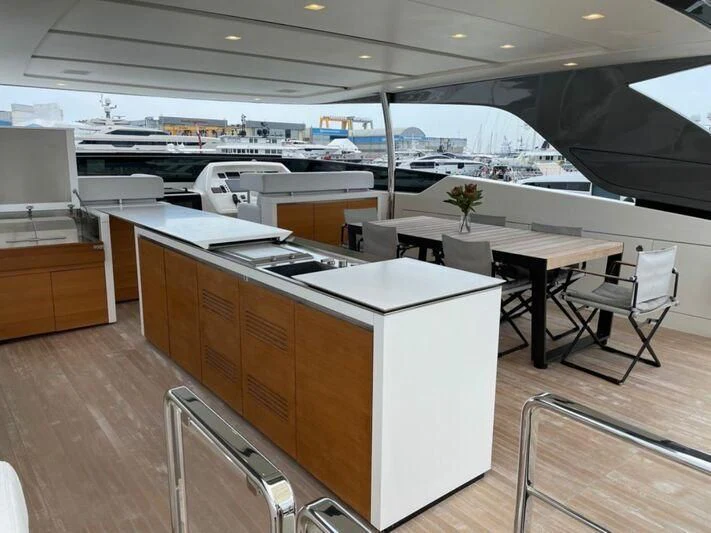 a large kitchen with white cabinets aboard PIACERE III Yacht for Sale