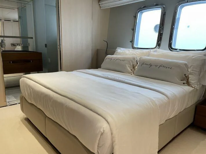 a bed in a room aboard PIACERE III Yacht for Sale