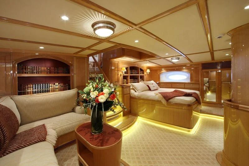 a living room with a couch and a table aboard MARIE Yacht for Sale