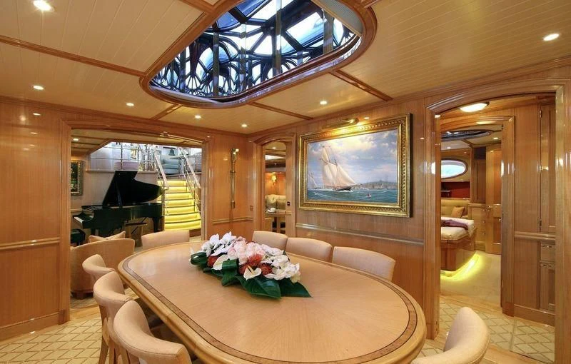 a large room with a table and chairs aboard MARIE Yacht for Sale