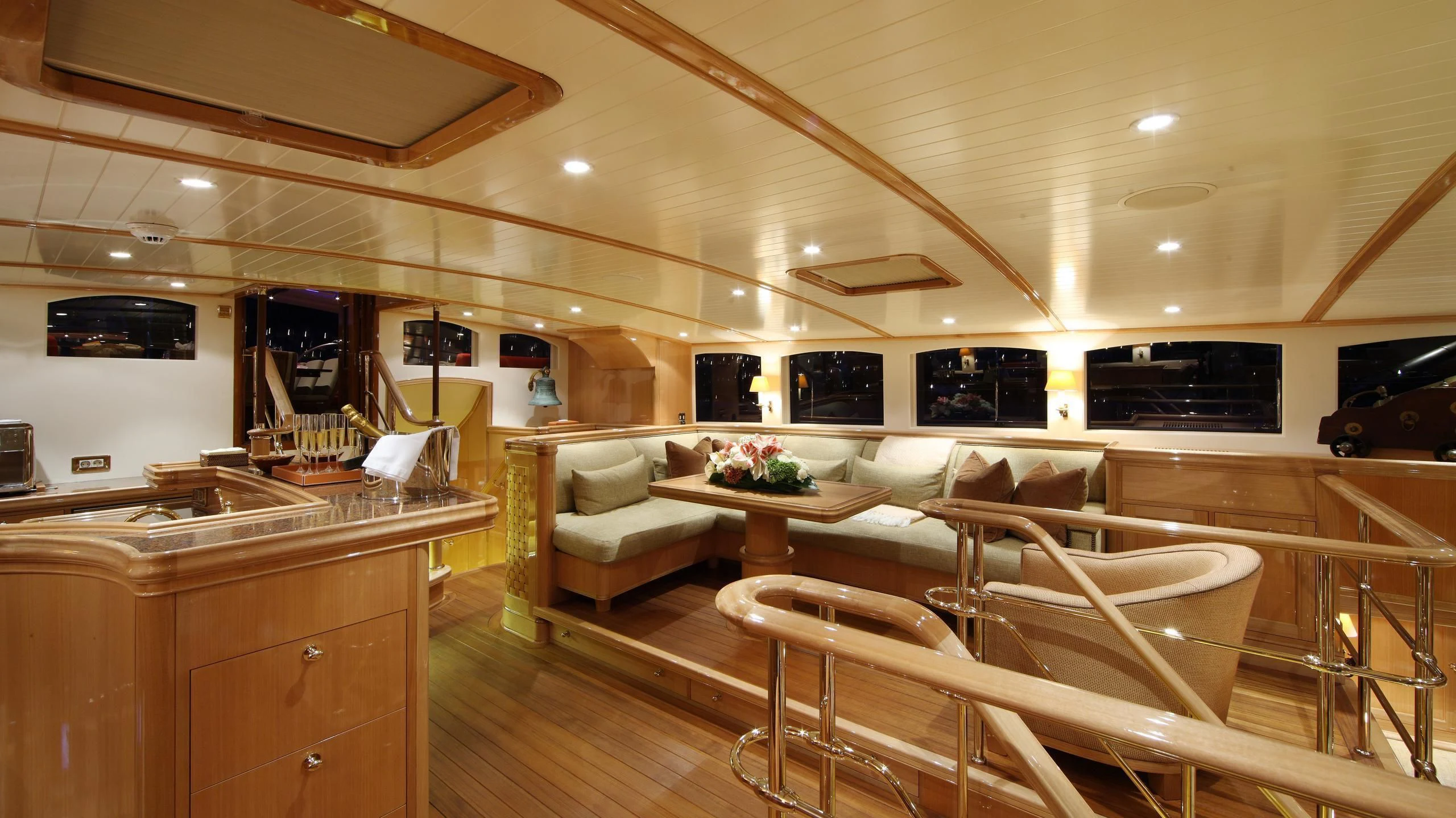 a large living room with a wood floor aboard MARIE Yacht for Sale