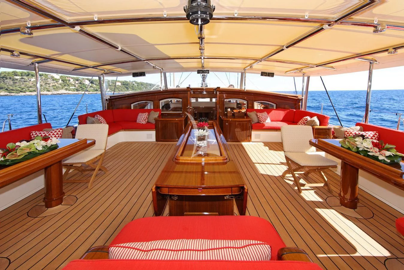 a boat with a table and chairs aboard MARIE Yacht for Sale