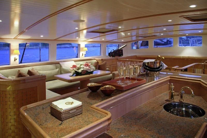a kitchen with a countertop sink and a large mirror aboard MARIE Yacht for Sale