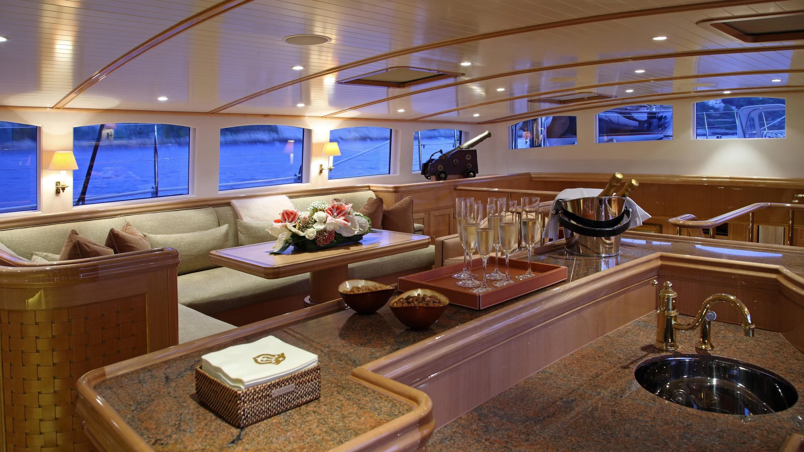 a kitchen with a countertop sink and a large window aboard MARIE Yacht for Sale