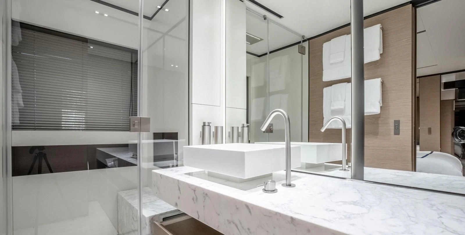 a bathroom with a large mirror aboard OCEAN Z Yacht for Sale