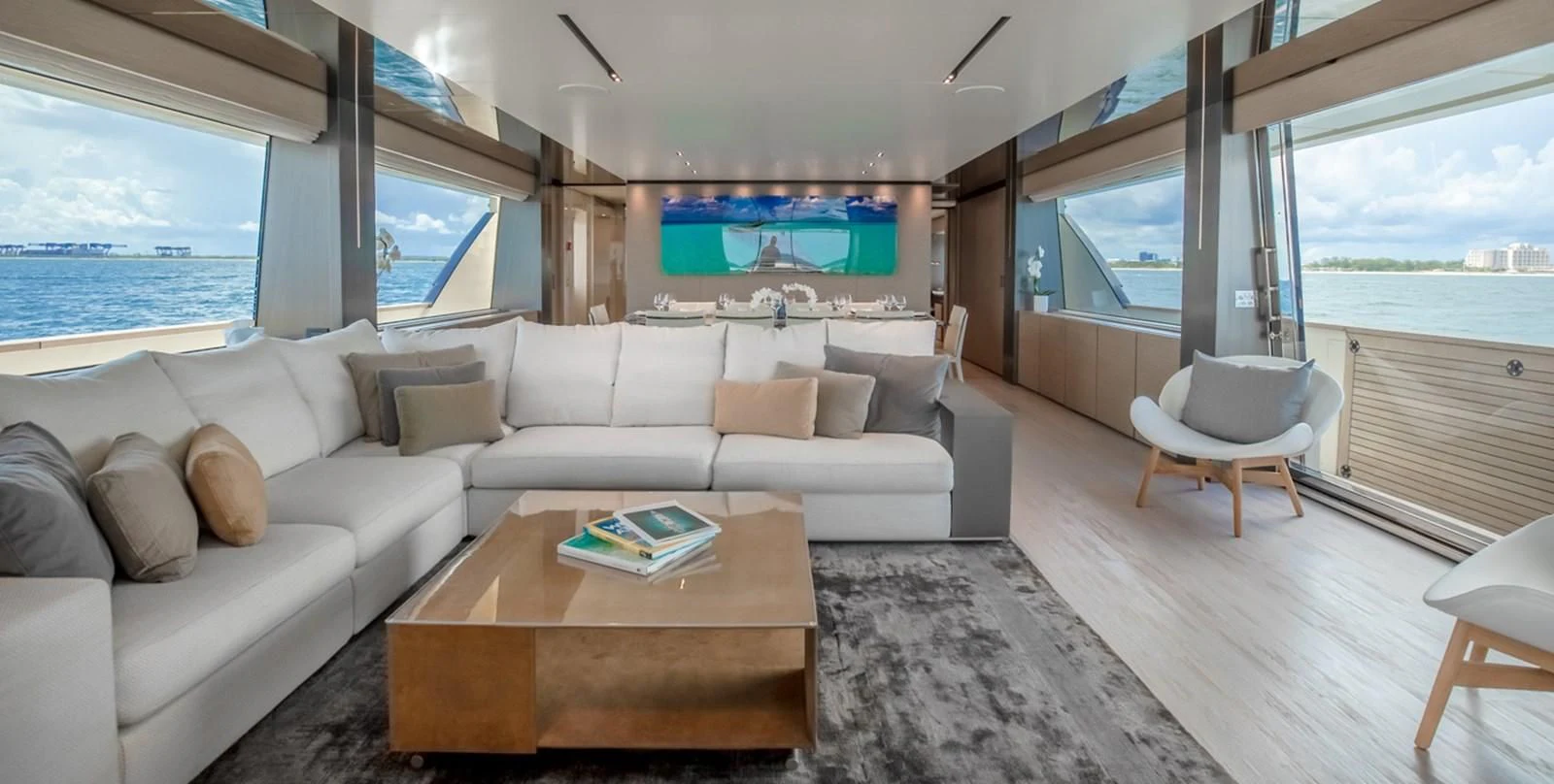 a living room with a large window aboard OCEAN Z Yacht for Sale