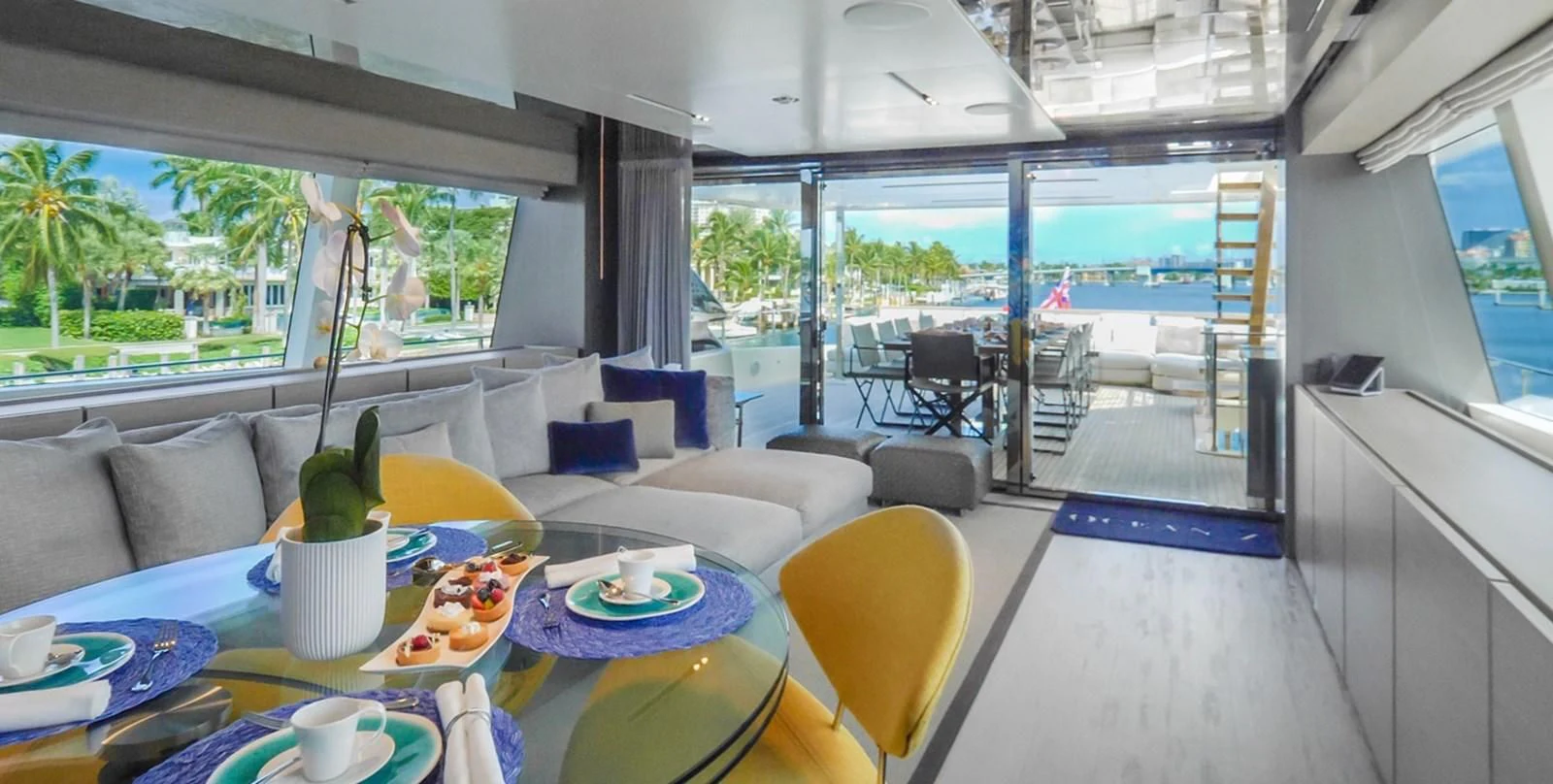 a living room with a large patio aboard OCEAN Z Yacht for Sale