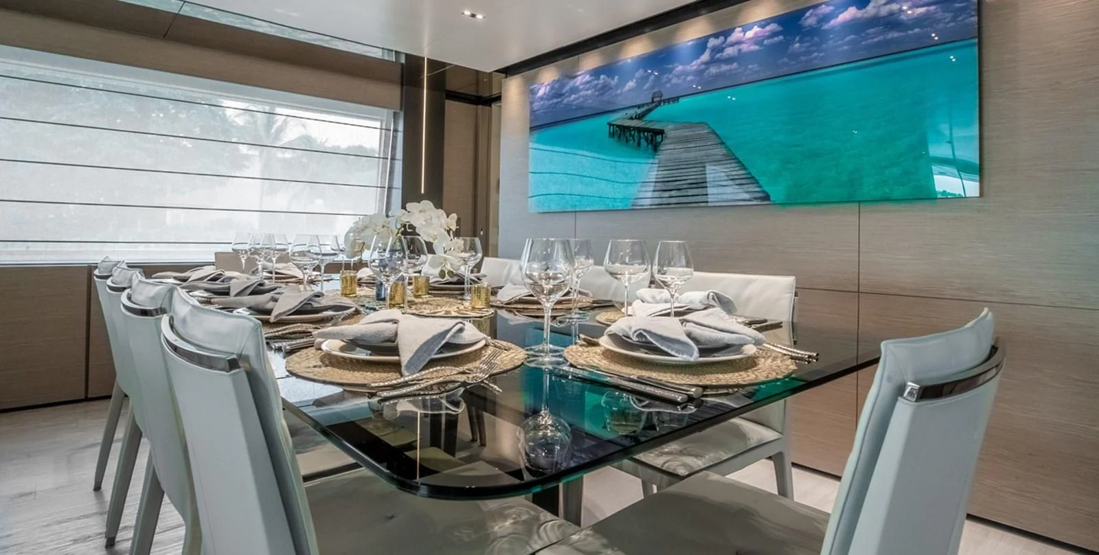 a table with plates and glasses aboard OCEAN Z Yacht for Sale