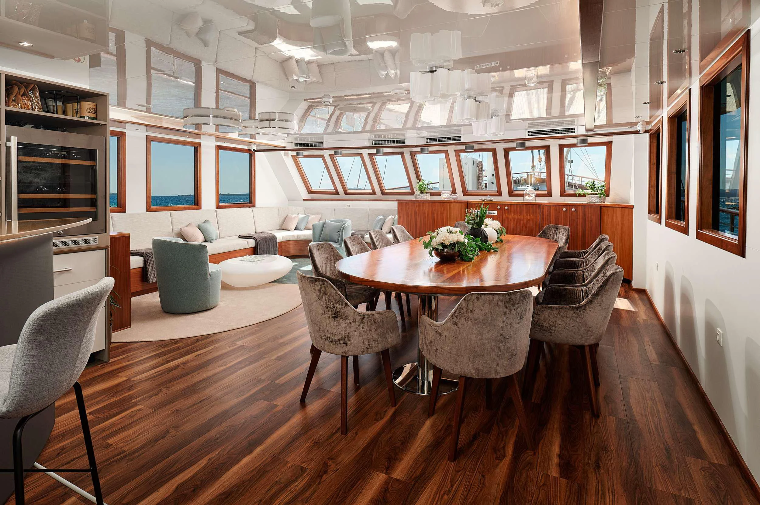 a room with a table and chairs aboard CORSARIO Yacht for Charter