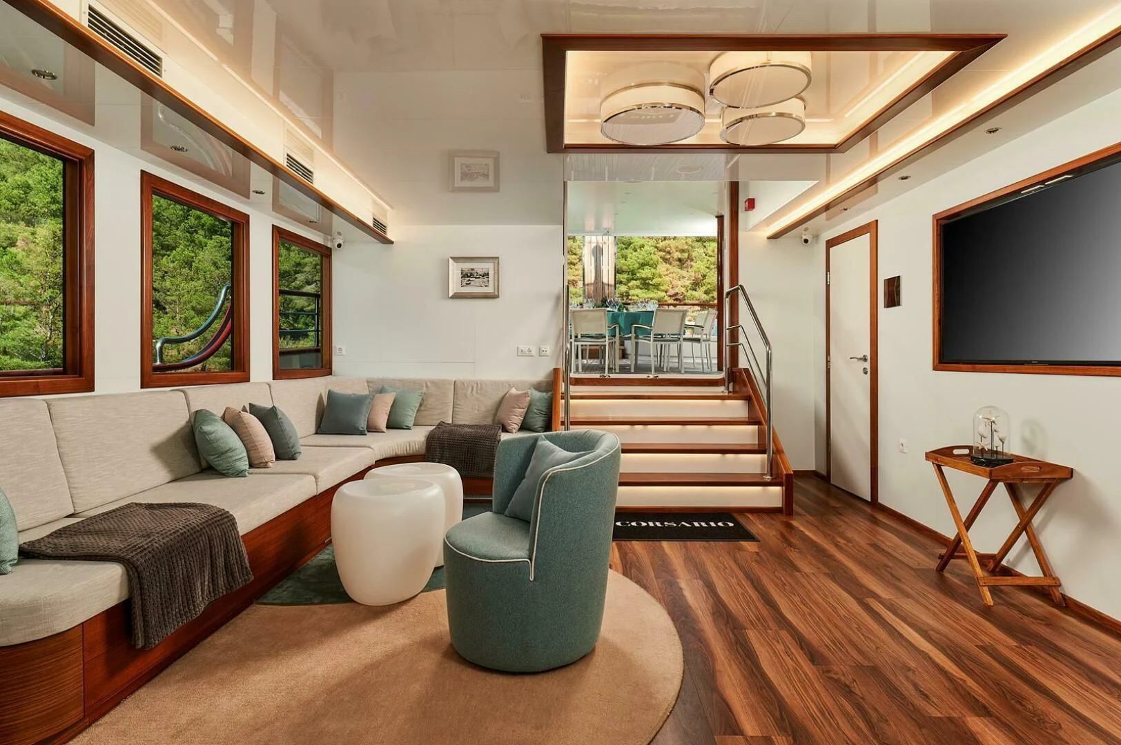a living room with a large window aboard CORSARIO Yacht for Charter