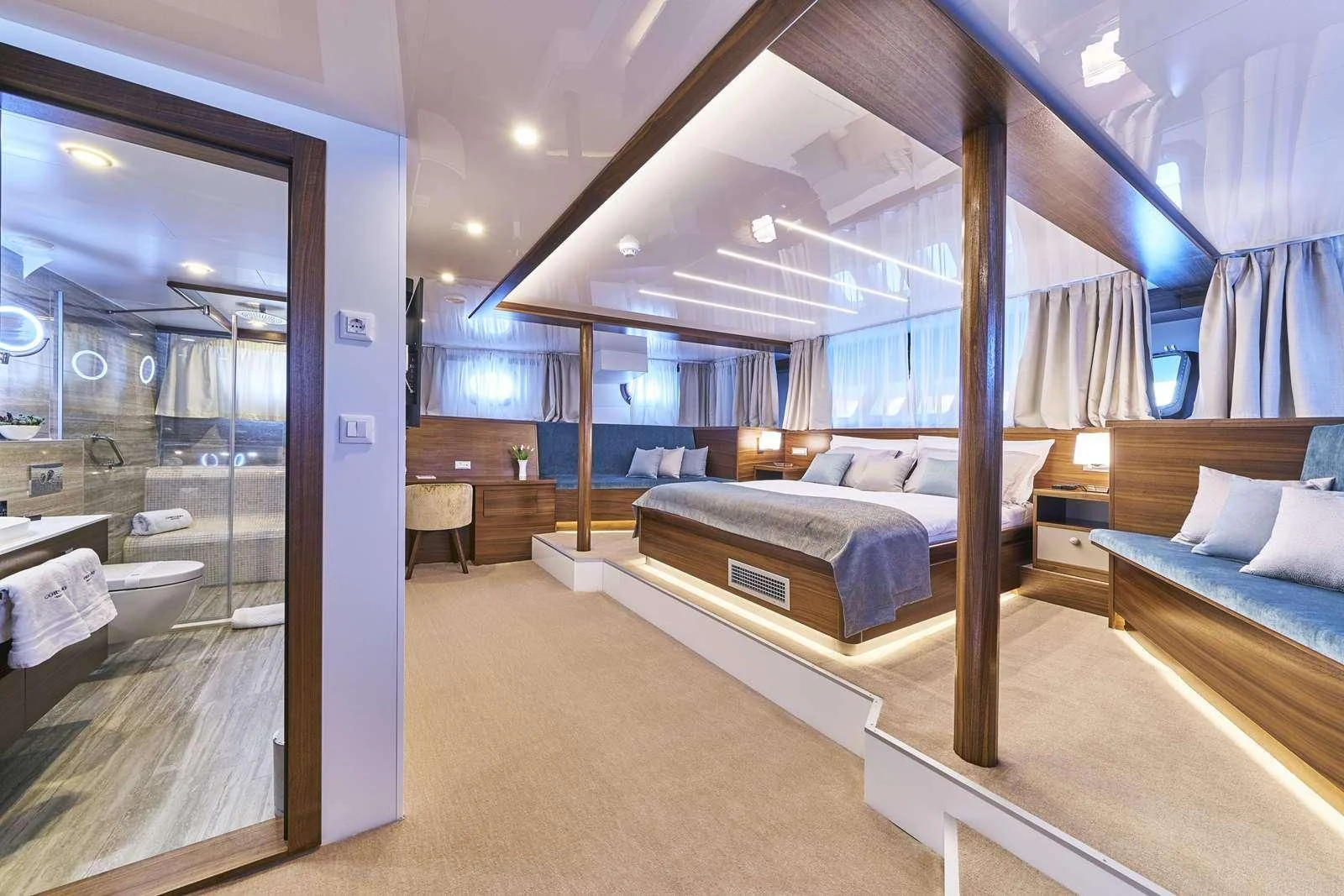 a room with a bed and a mirror aboard CORSARIO Yacht for Charter