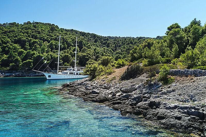 a boat sailing on the water aboard CORSARIO Yacht for Charter