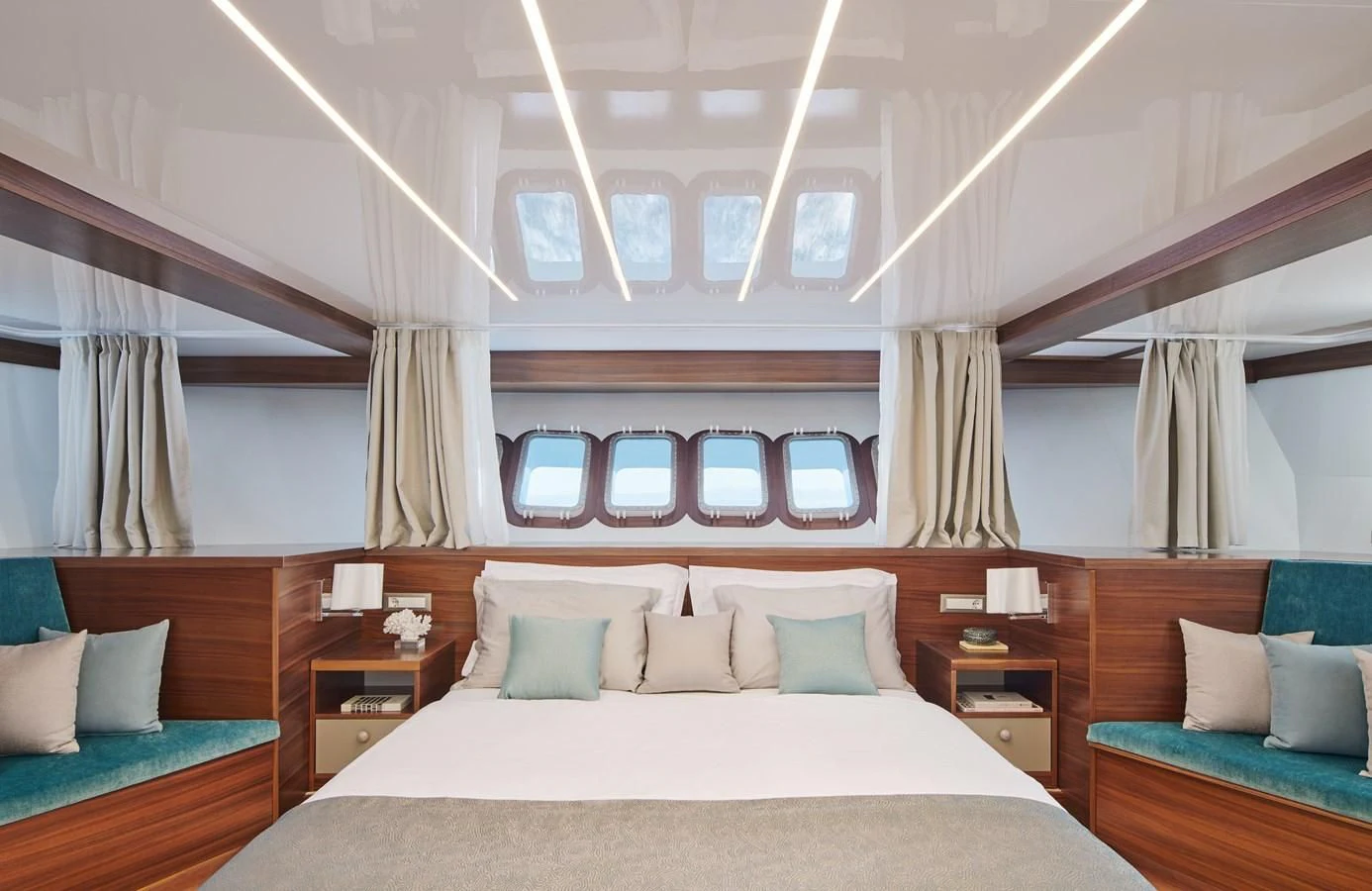 a room with a bed and a window aboard CORSARIO Yacht for Charter