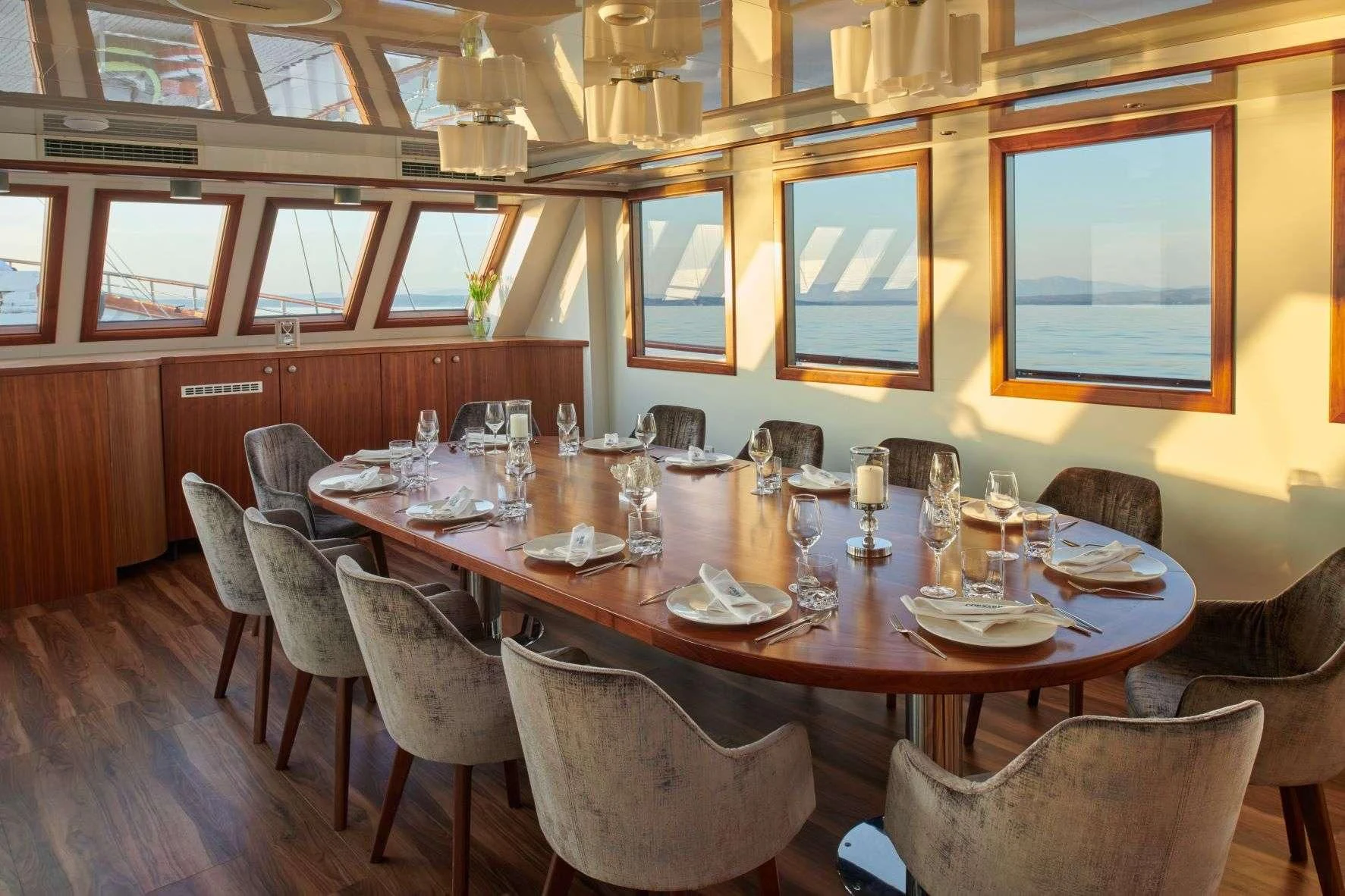 a dining room with a table set aboard CORSARIO Yacht for Charter