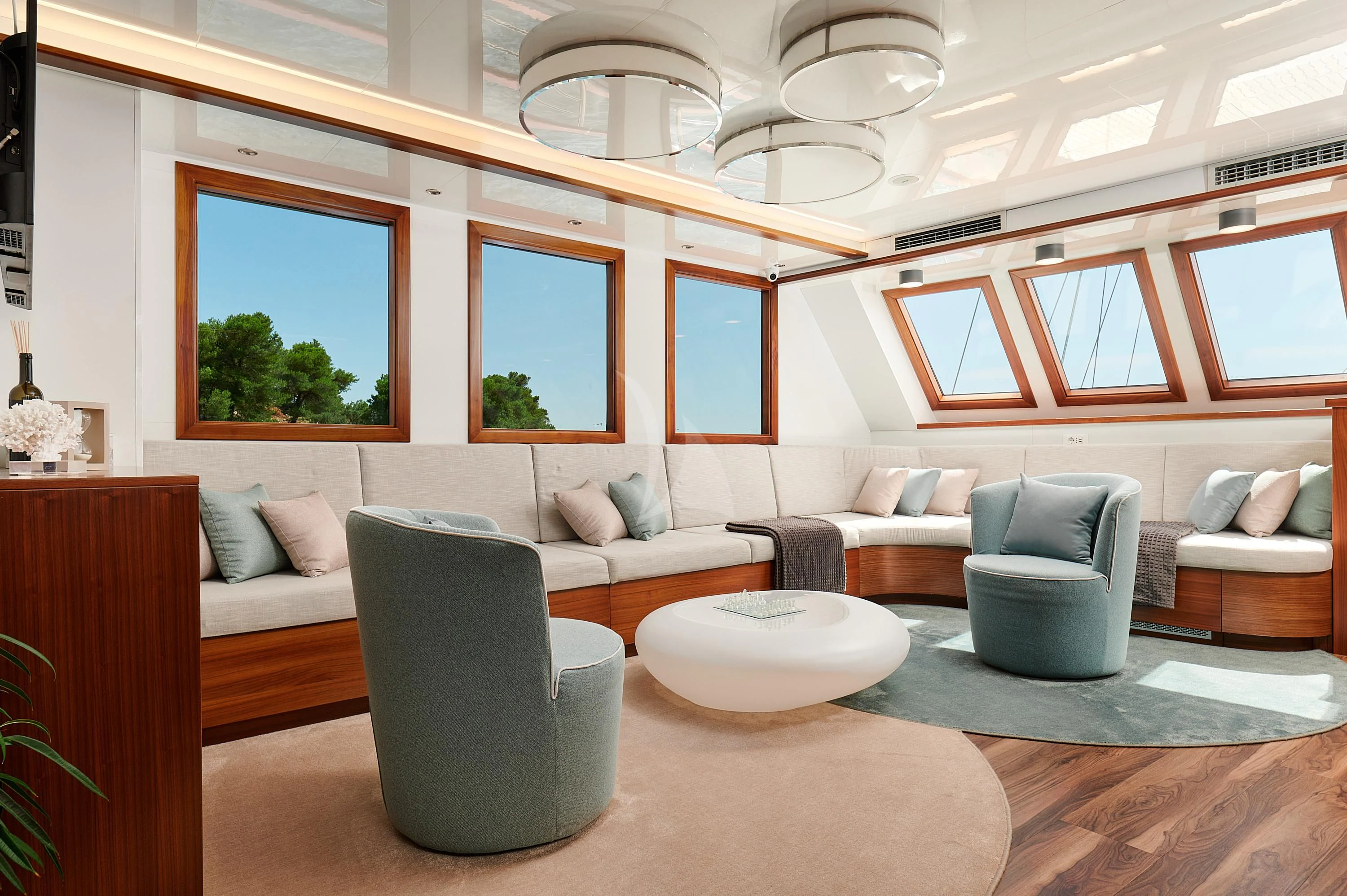 a living room with a large ceiling aboard CORSARIO Yacht for Charter