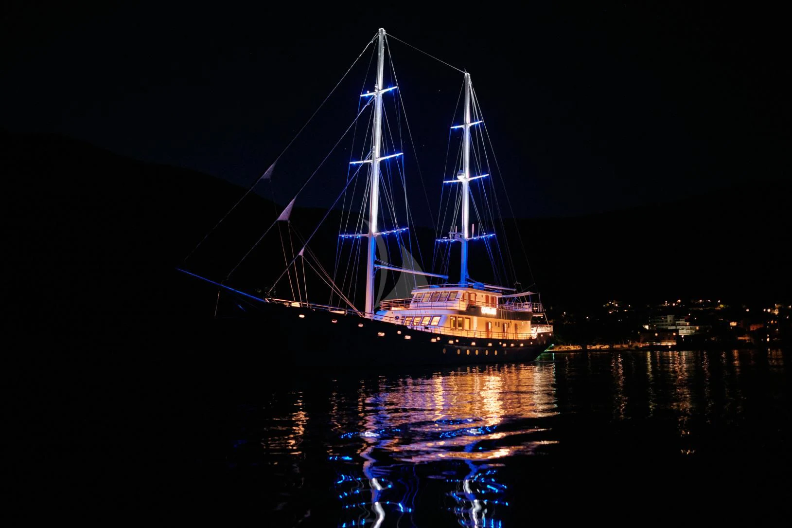 a large sailboat at night aboard CORSARIO Yacht for Charter